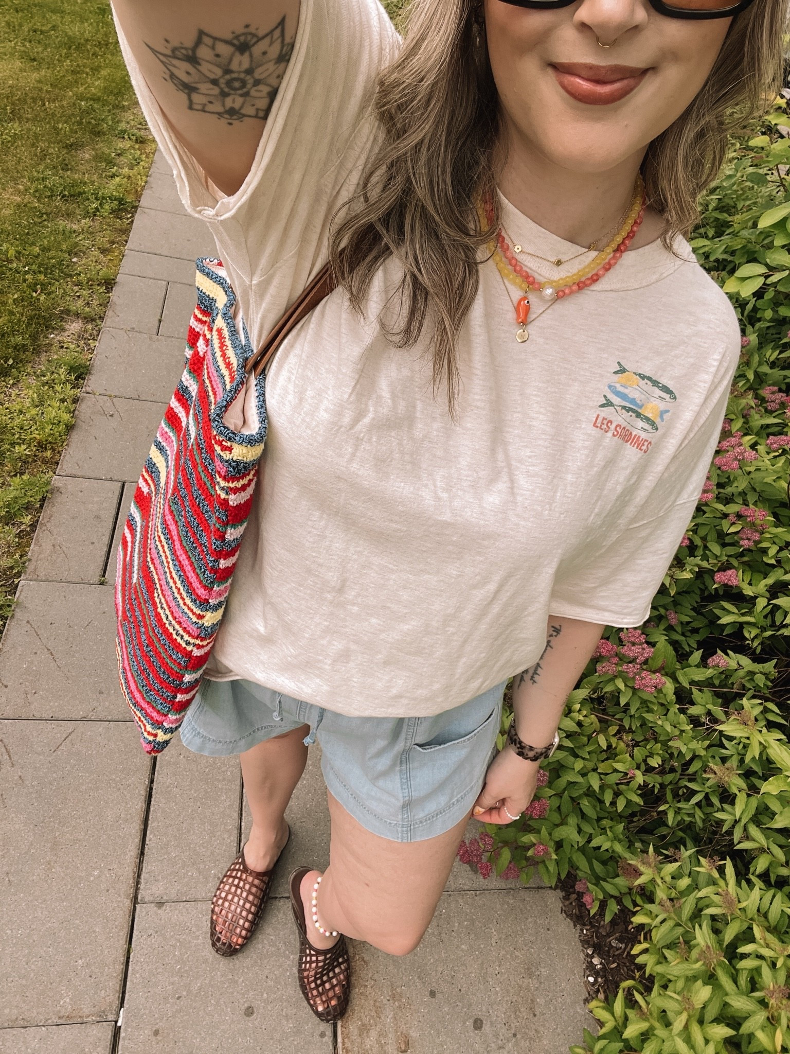 Comfy summer ootd! Wearing my usual size L in the graphic tee and shorts. I’m a 9.5-10 shoe and wear a 10 in the jelly shoes. Canadian shoes and bag links under “similar products”

#LTKsummer #LTKmidsize #LTKstyletip
