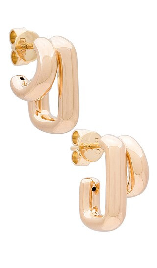 Double Gold Jumbo Huggie Earrings in Yellow | Revolve Clothing (Global)