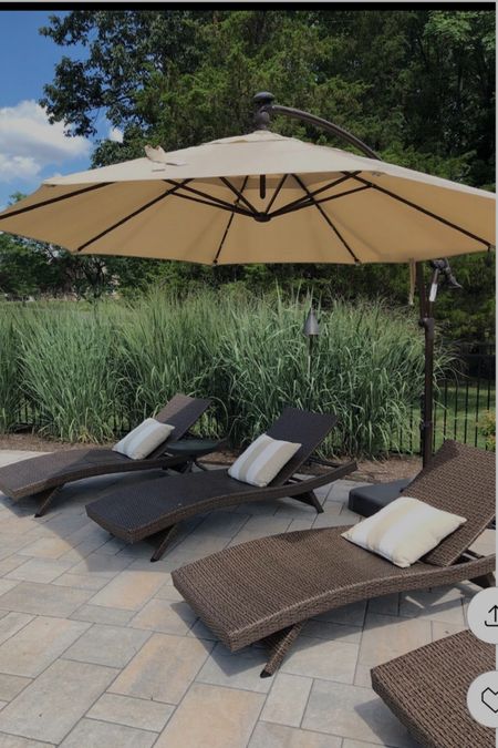 Outdoor living on the patio!  Outdoor wicker lounge chairs, cantilever umbrella, and outdoor throw pillows with cabana stripes!

#ltkpatio #ltkcabanastripes

#LTKSeasonal #LTKhome #LTKstyletip