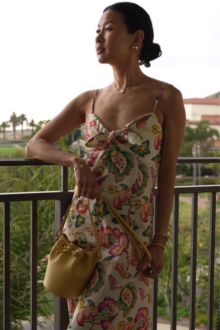 European summer vacation vibes with this floral midi dress. Love the front tie detail of this linen dress. It’s perfect for summer, travel, showers and more.

And how cute is this mini bucket bag? It comes in lots of beautiful colors  

#LTKOver40 #LTKStyleTip #LTKTravel