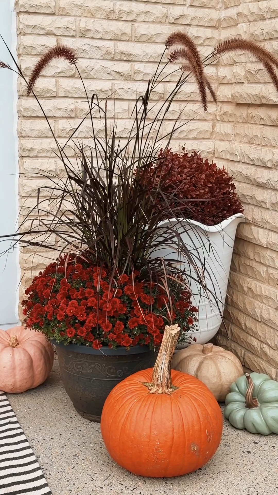 my first fall porch is almost ready! 🍂🎃🤎mixed some faux mums + faux pumpkins with real ones… so wish me luck because I’m officially pretending I know what I’m doing 

fall porch, porch idea, easy porch styling, faux outdoor, fall wreath, door wreath, fall decor, fall centerpieces, fall front porch decor, fall porch rug, fall porch doormat

#LTKHome #LTKSaleAlert #LTKstorytime