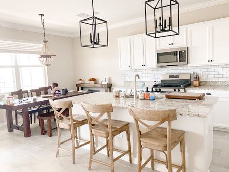 ✨Sometimes all it takes is the slightest changes to make the biggest difference✨ we added farmhouse barstools, pendant lighting, chandelier over the dining table, changed all the hardware, and picked out a backsplash to transform this kitchen entirely and tastefully 🤍

#LTKFind #LTKhome #LTKfamily