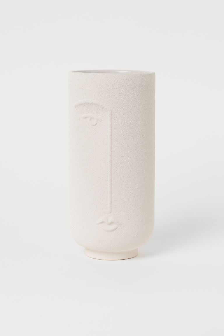 Stoneware vase with a face motif. Height 11 1/4 in. Diameter 5 in.Weight1,86 kgCompositionStone w... | H&M (US + CA)