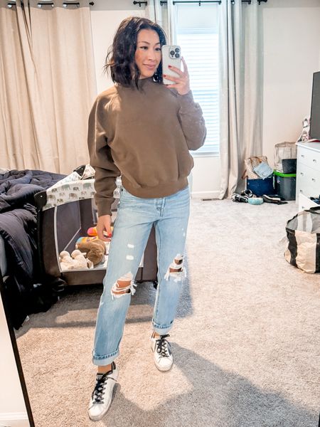 Essentials fear of god sweatshirt- I am wearing size XXS, it’s still baggy but not overly oversized. They generally are oversized, but this is the women one in XXS.

Levi’s jeans in 501 cropped style- it’s baggy in a good way. I wear size 24, I do wear a belt with these. But super comfy. 

Golden goose low classic sneakers- so comfy, I know the hype. I wear women’s size 5, TTS for me.

#LTKMostLoved #LTKshoecrush #LTKstyletip