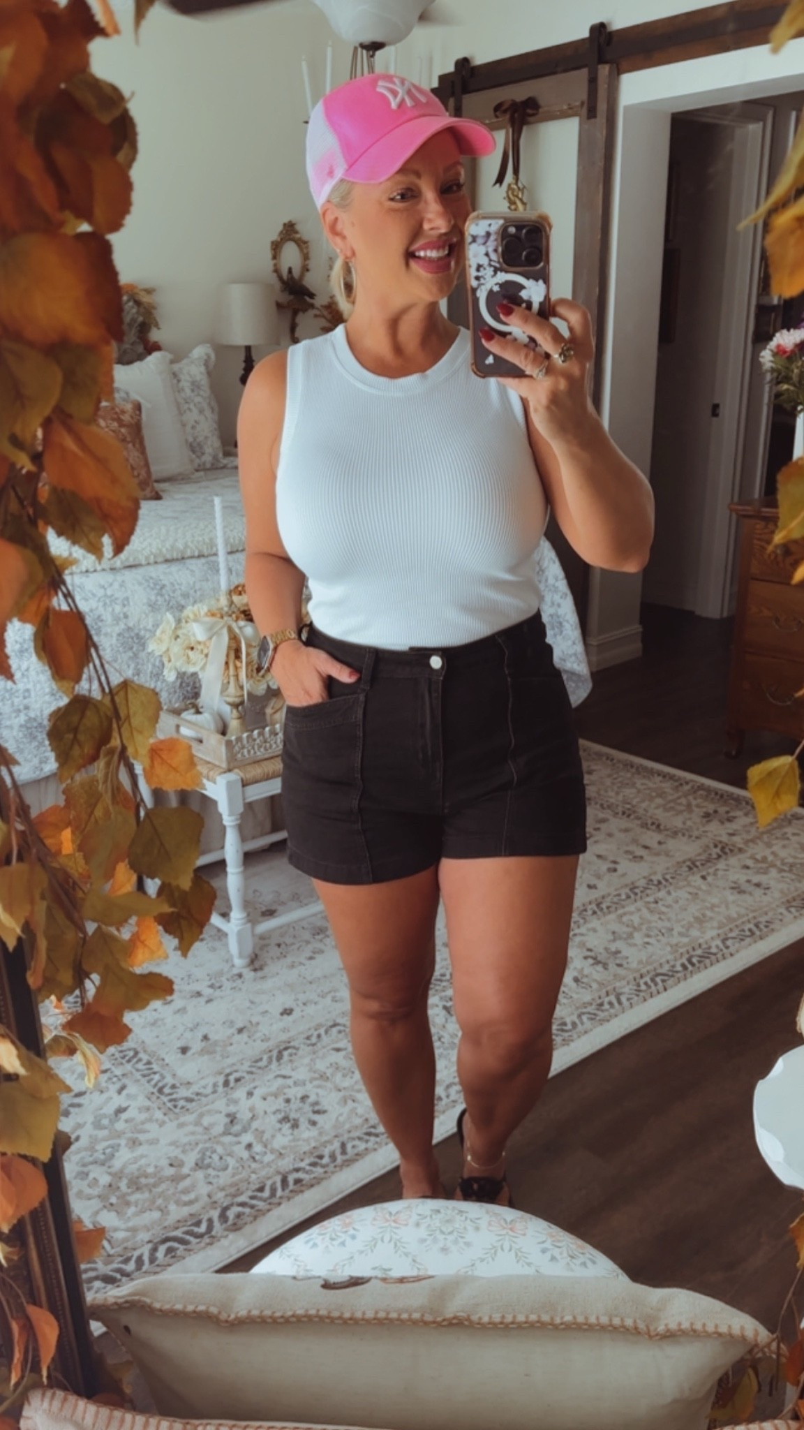 A white tank and black jean shorts paired with a pink hat is such a cute, comfy, classic game day look!! I love the big front pockets on these shorts!

#LTKootd #LTKOver40 #LTKselfcare