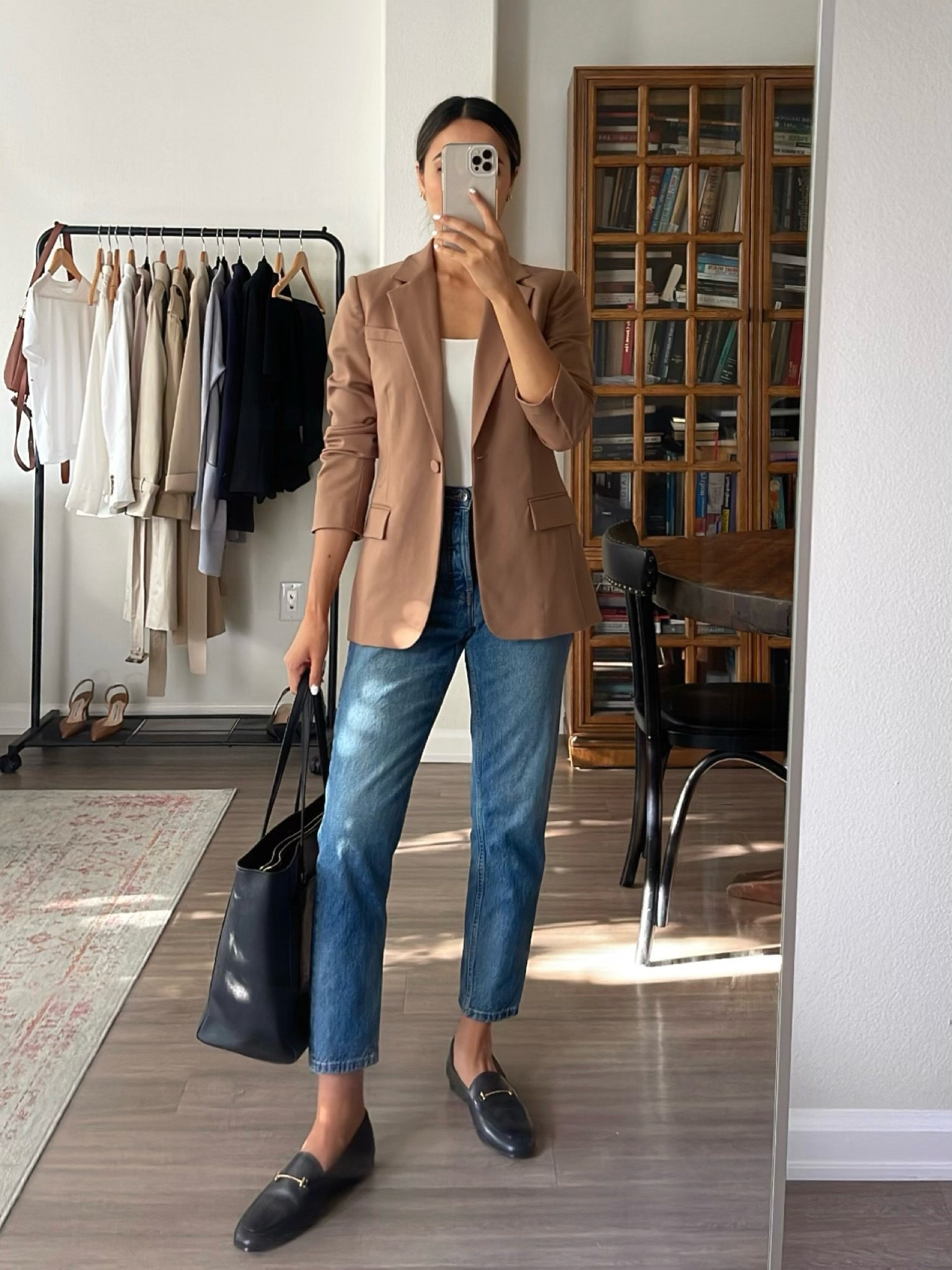 Business casual/smart casual office outfit 

Blazer is sold out and loafers are being phased out, linked to similar ones 

- camel blazer, white top, white tank, blue jeans, loafers, black tote bag 

#LTKworkwear #LTKstyletip