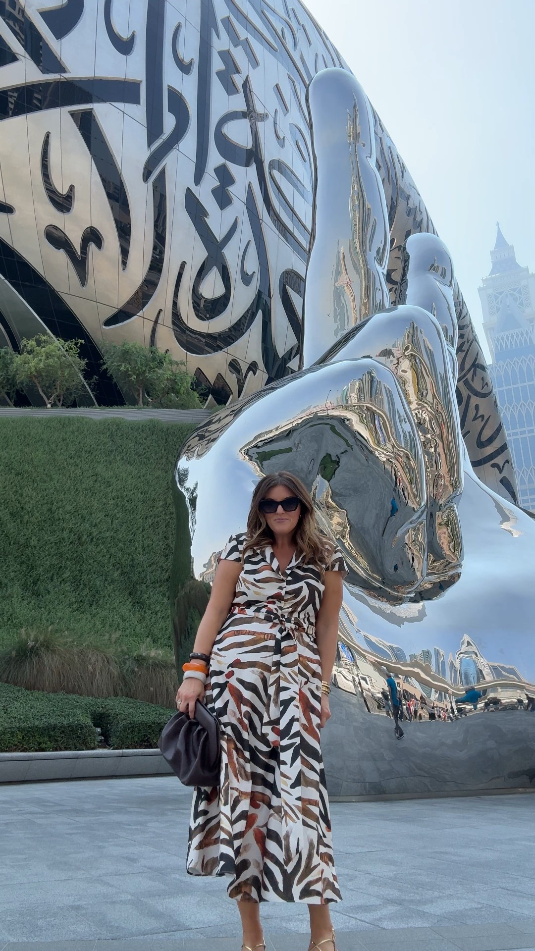 the most perfect dress for sightseeing in dubai! Felt appropriate from a cultural/coverage standpoint but loved how it was airy for the hot temps (97!!) yet still in fall colors…animal print is basically a neutral IMO. Wearing a size 12

Just bought this @themorie clutch which I’ll be wearing all winter long - such great craftsmanship for the price point 

Paired it with some gold strappy sandals, chunky bangles & my favorite @krewe sunnies 

#LTKStyleTip #LTKMidsize #LTKFindsUnder100