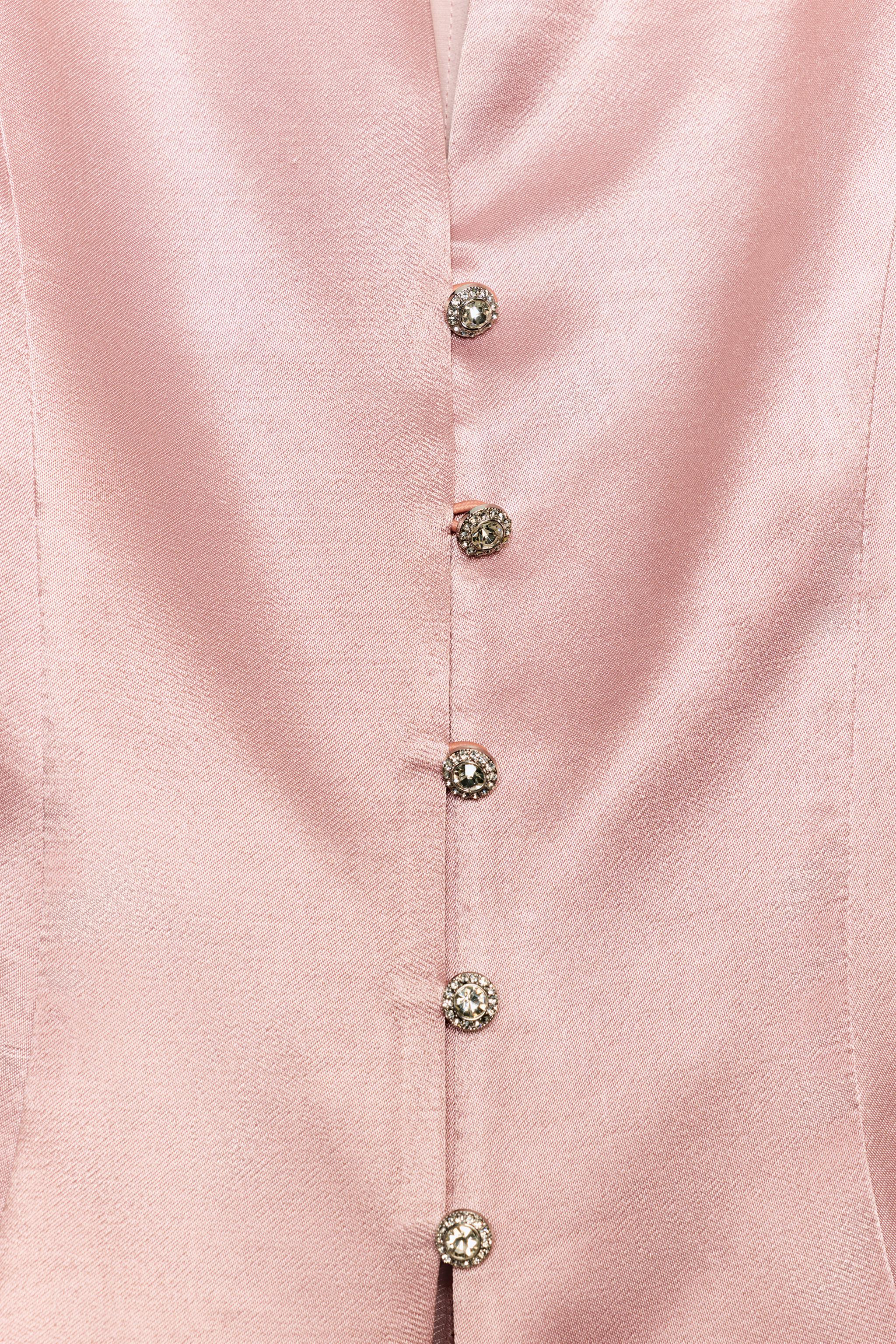 V-neck sleeveless top. Front jewel button closure. | Zara US