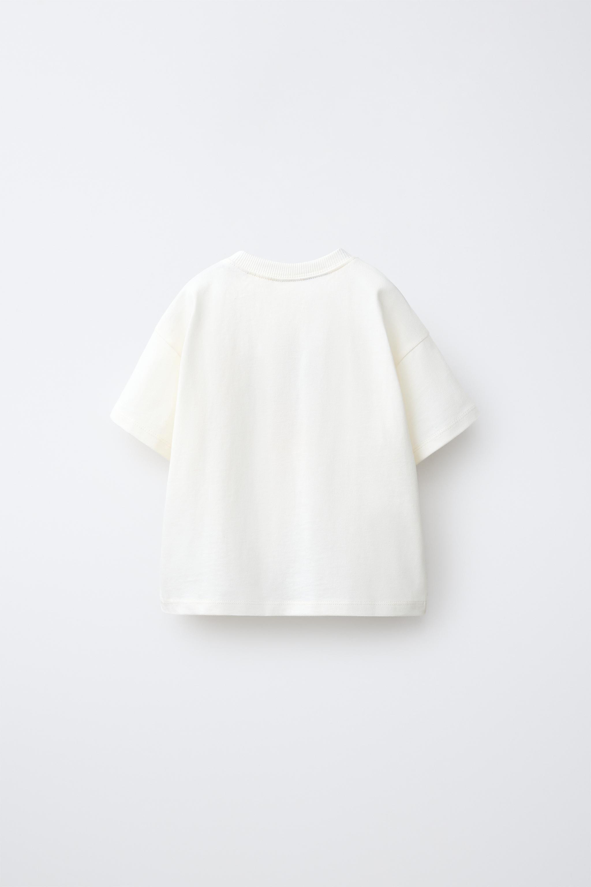 Round neck T-shirt with short sleeves. Features a MICKEY MOUSE \u00a9 DISNEY cross stitch embroid... | Zara UK