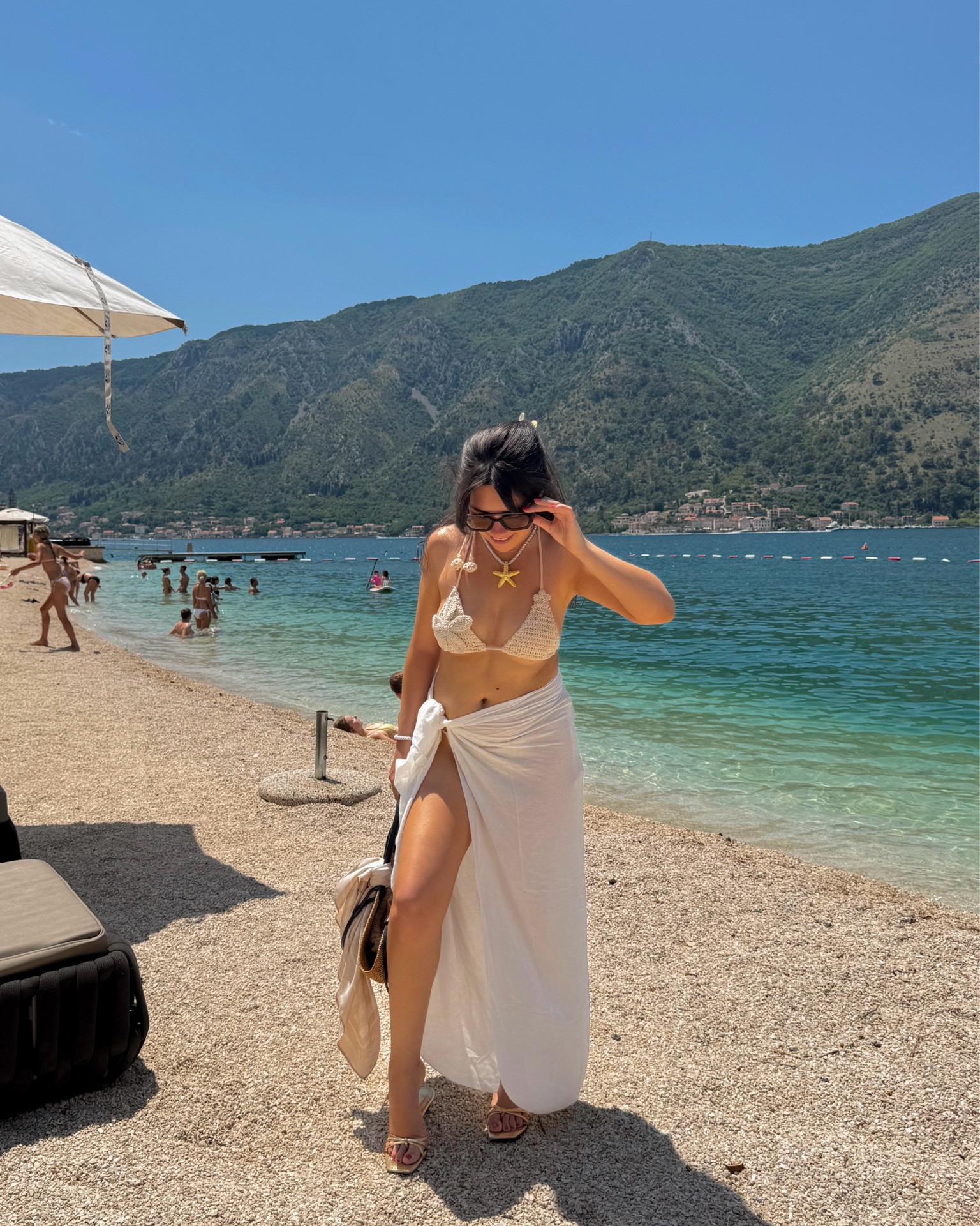 Beach club uniform ☀️🤍 The crochet bikini is even cuter in person, and I threw on a breezy white sarong, neutral sandals, and oversized sunnies for an effortless vacation look. Everything linked here (or similar pieces if sold out)! 🌊✨

#LTKSeasonal #LTKSwim #LTKTravel