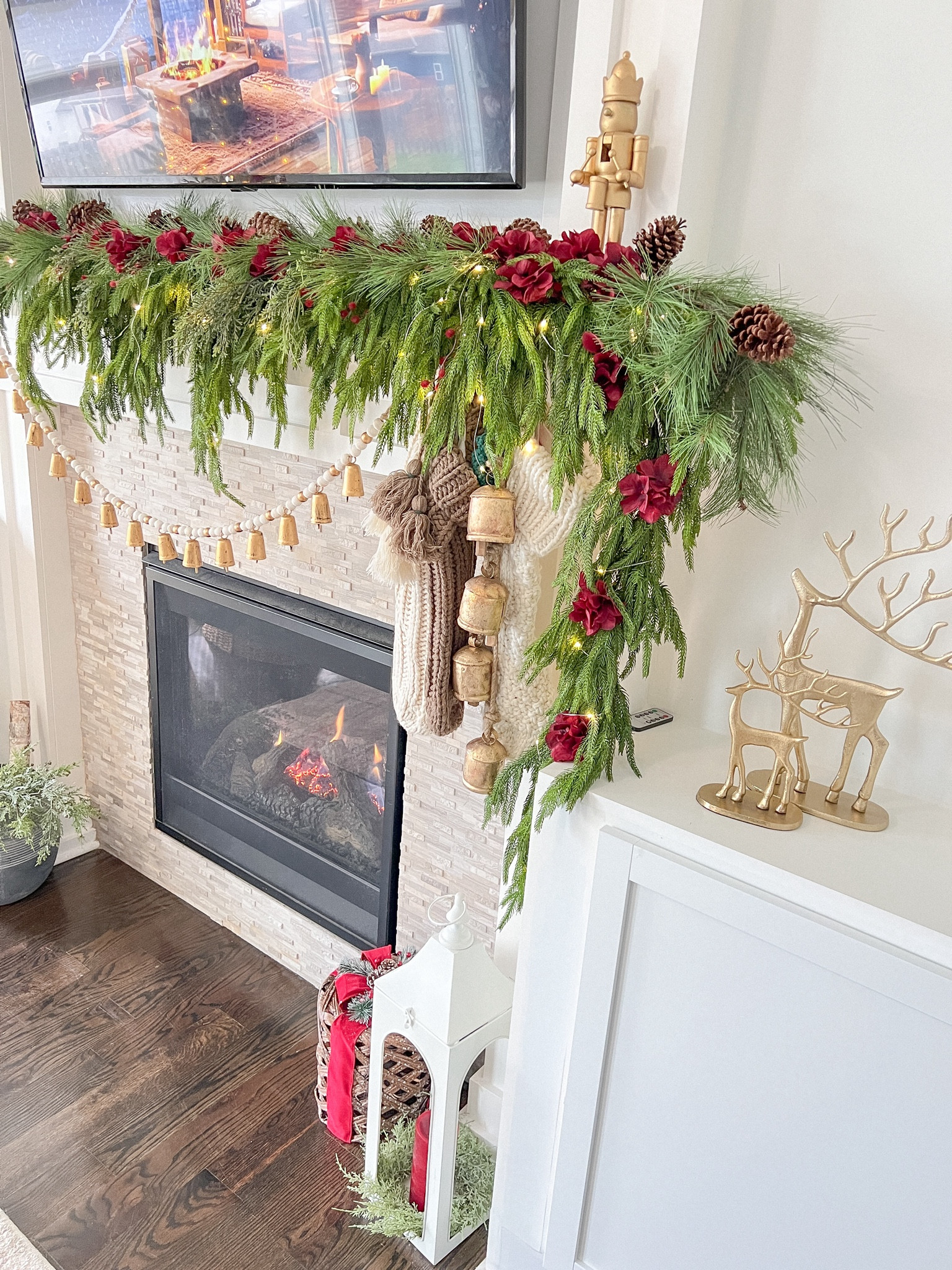 Loving how my mantle turned out 😍I added the needle pine stems to fill my norkfolk pine garlands and I added on top those beautiful Amaryllis from the Jumbo ornaments by My Texas House. 

#christmasdecor #holidaydecor #homedecor

#LTKHoliday #LTKhome #LTKSeasonal