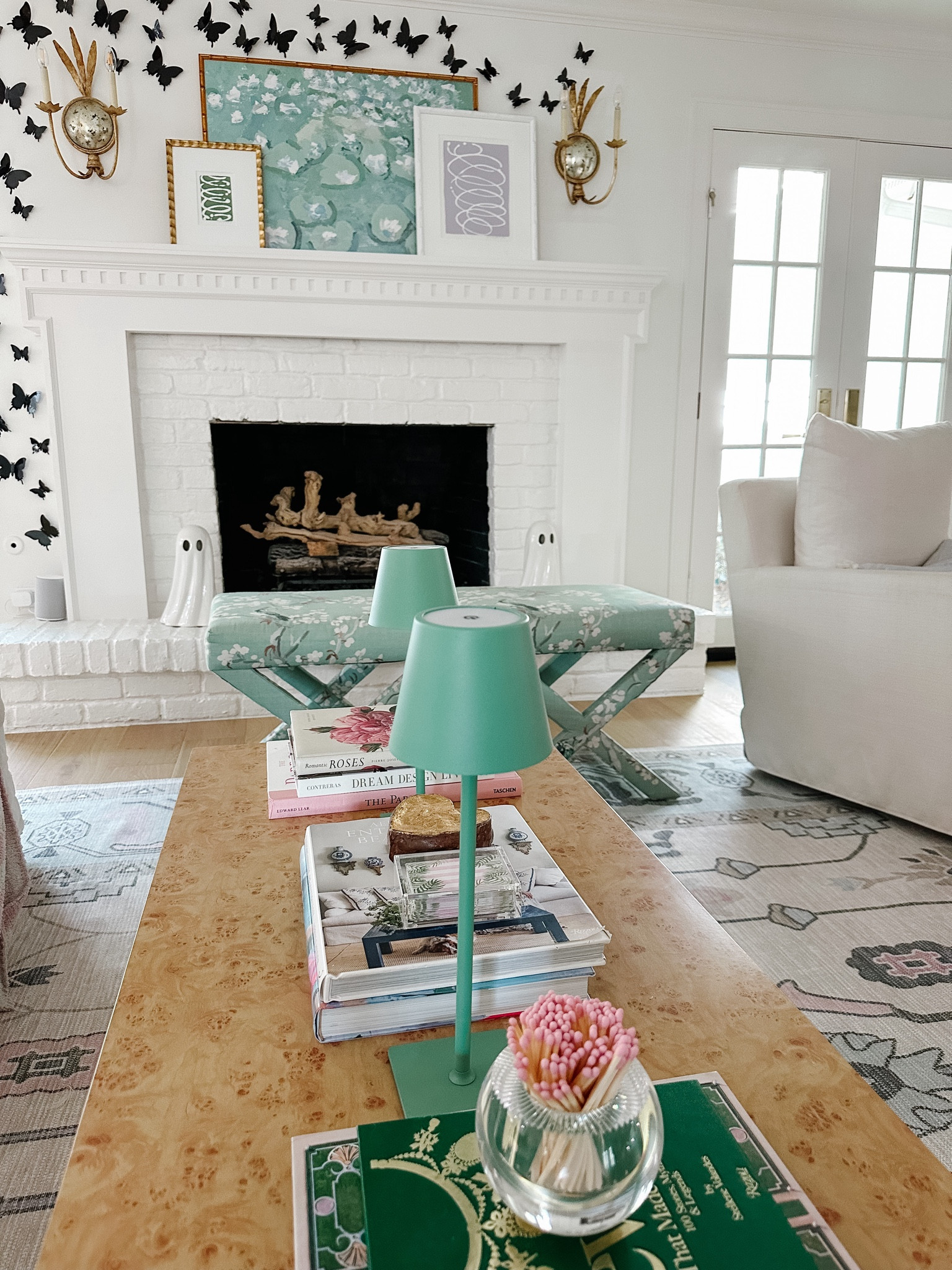 Our living room with a scalloped burlwood coffee table. 

#LTKHome