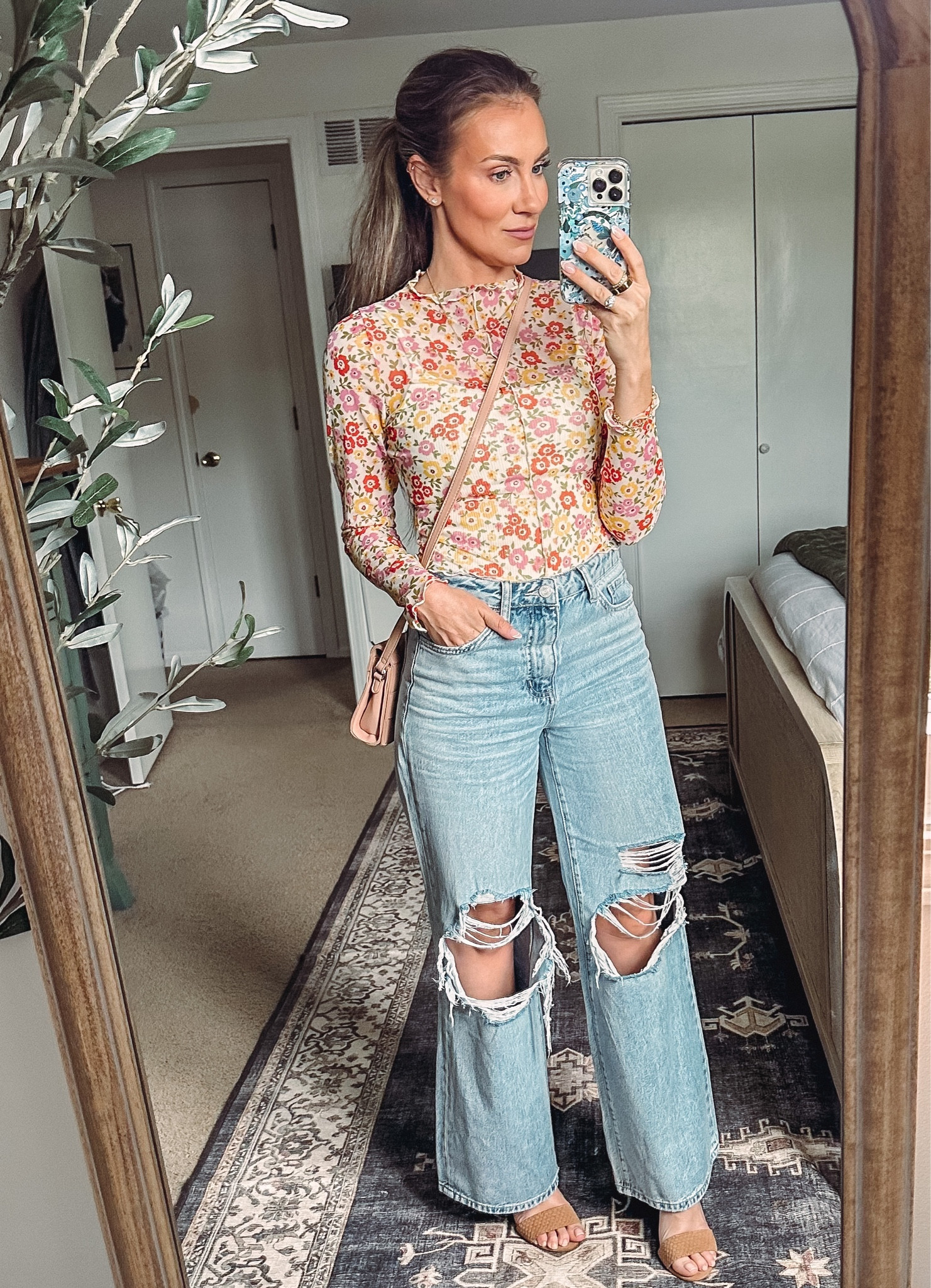 Cutest spring outfit inspired by Daisy Jones and the Six. Floral mesh top and 90s wide leg jeans fit TTS and both from Vici. Wearing Small in top. Crossbody bag from Amazon and under $20. #founditonamazon

#LTKSeasonal #LTKitbag #LTKunder50