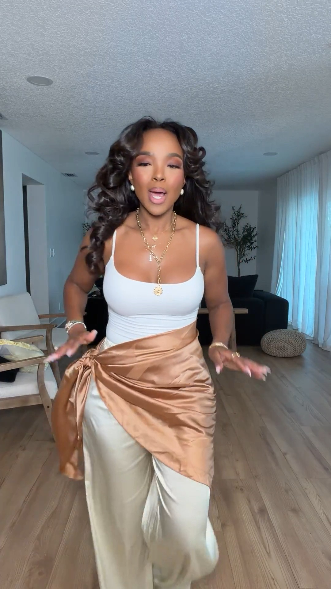 Hi Babes!

This look feels like a luxury vacation outfit without the luxury price tag. The silky champagne pants paired with the white tank create the prettiest neutral palette, while the satin wrap detail instantly makes the entire outfit feel elevated and unique.

I love pieces like this because they look expensive, photograph beautifully, and can easily be styled multiple ways. The soft gold and cream tones are timeless and give that effortless resort-wear vibe that's always in style.

Where to wear this:
• Beachside dinner
• Vacation nights
• Resort getaway
• Rooftop cocktails
• Summer date night
• Cruise dinners

Everything is linked below.

Comment SHOP below to receive a DM with the link to this post on my LTK ⬇

xx Kira | IG: KirasFashionFinds

34D - 27 - 40 • Size Small or 4

#LTKgrwm #LTKootd #LTKPetite