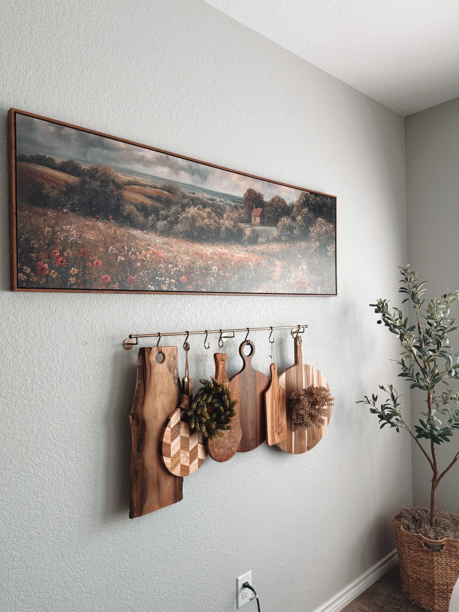 Cozy kitchen wall decor goals ✨ This farmhouse-inspired setup features a rustic wall-mounted cutting board display, perfect for adding warmth and texture to your space. I styled a mix of wood tones, including live edge, striped, and chevron boards for that curated, collected look. Love the cottagecore vibes from this wildflower landscape print above 🤍🌾 

Shop neutral home decor, modern farmhouse accents, cutting boards for decor, and kitchen wall art. Perfect for cozy minimalist, organic modern, or transitional style homes! #LTKhome #kitchendecor #farmhousestyle #homedecorideas #neutraldecor #cuttingboarddecor #wallart #cottagedecor #amazonhome #targethome #cozykitchen #ltkfinds


#LTKHome #LTKStyleTip #LTKFindsUnder50