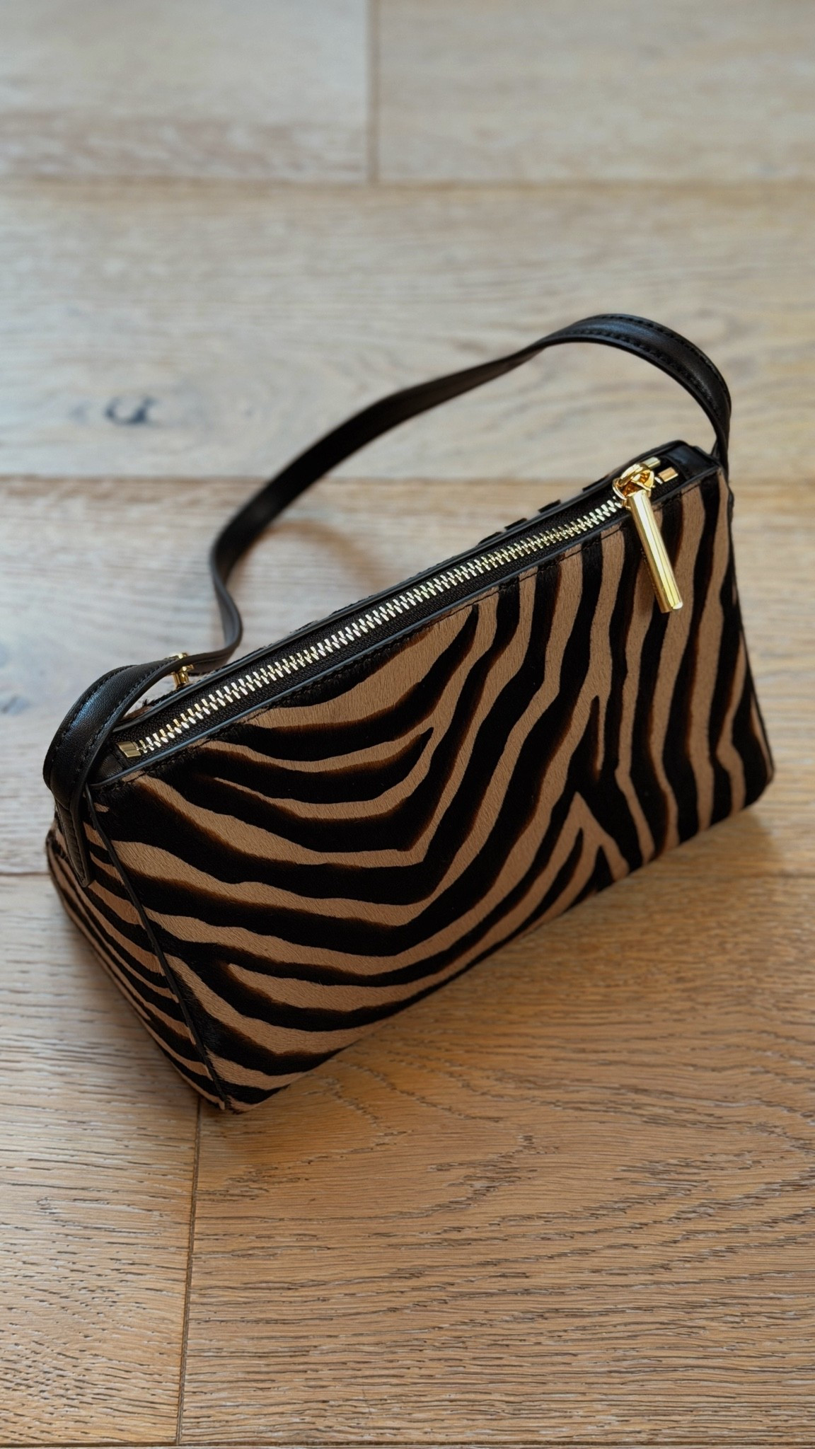 The bag everyone is talking about! Genuine calf hair in a bold zebra pattern, quite roomy, adjustable straps

#LTKootd #LTKSeasonal #LTKgrwm