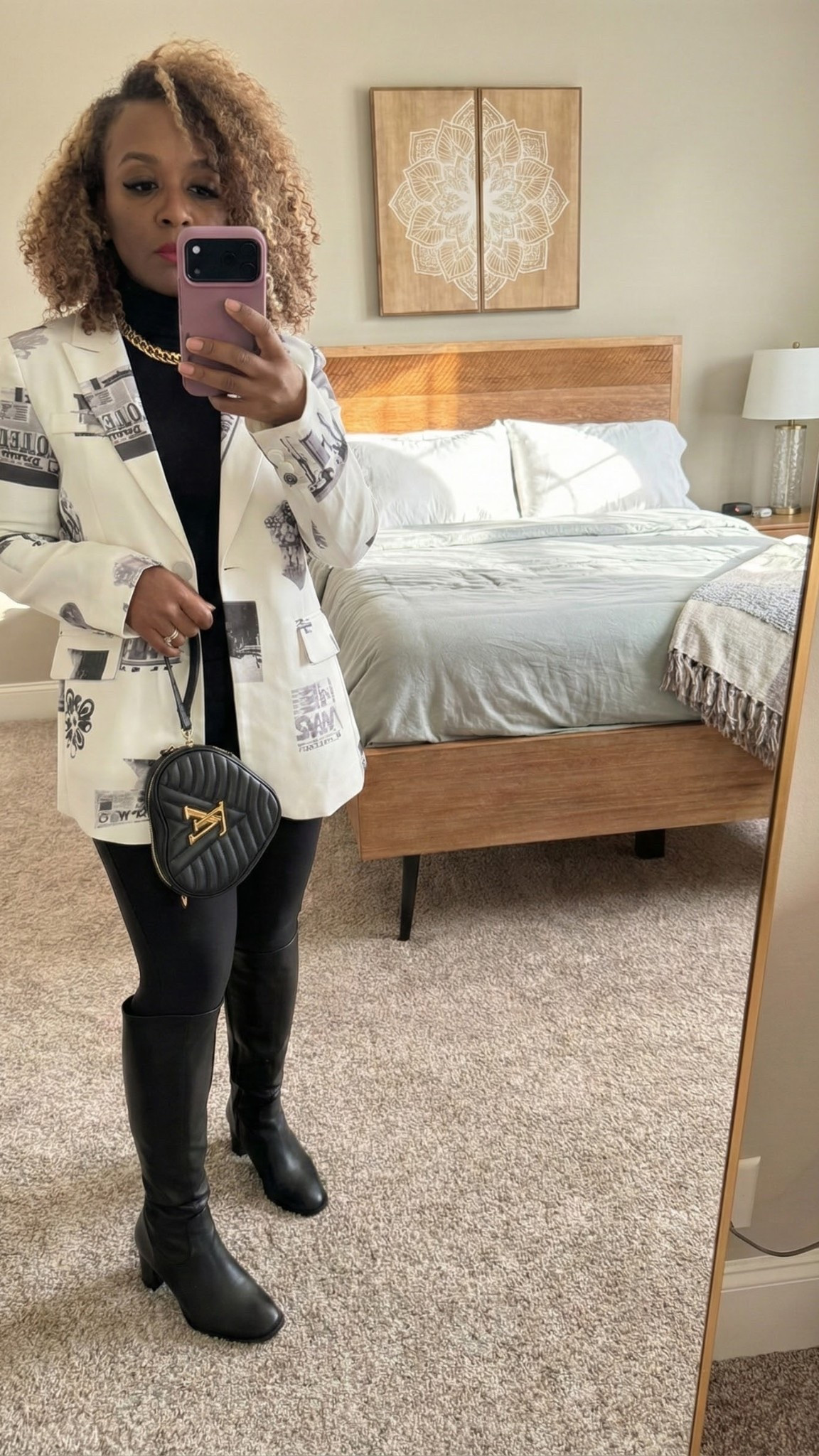 When the dress code is 'Business Creative.' 📰🖤 This newsprint blazer elevates a simple all-black base. Paired with my favorite knee-high boots and a statement bag.

#LTKootd #LTKHoliday #LTKdayinmylife