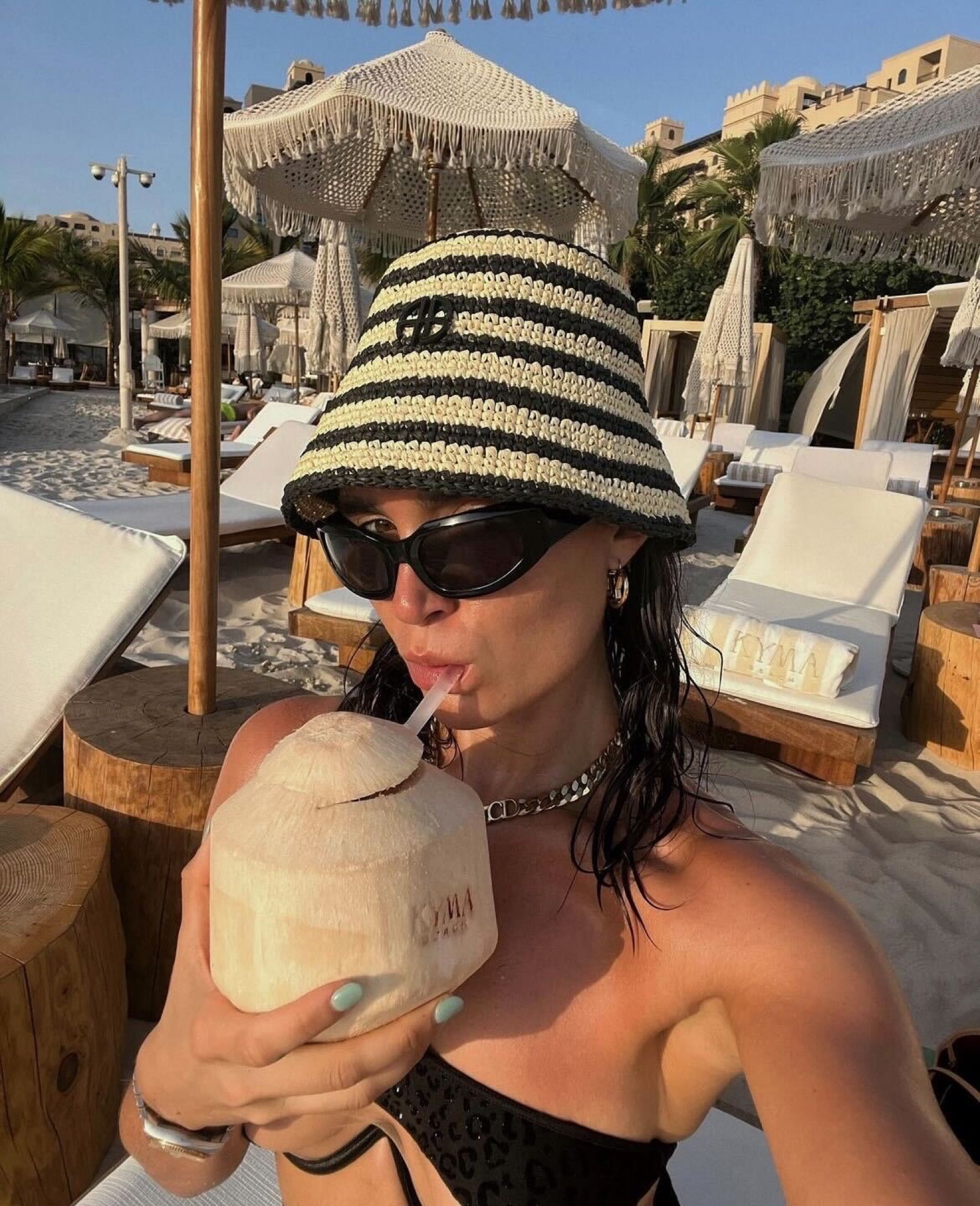 Bucket hat, straw hat, raffia hat, holiday hat, stripe hat, black sunglasses, visor sunglasses, chunky necklace, chain necklace, silver necklace, chunky chain silver necklace, Dior necklace, black bikini top, one shoulder bikini, holiday outfit, summer outfit, monochrome outfit, anine bing, ego, vestiaire collective

#LTKSeasonal #LTKeurope #LTKtravel