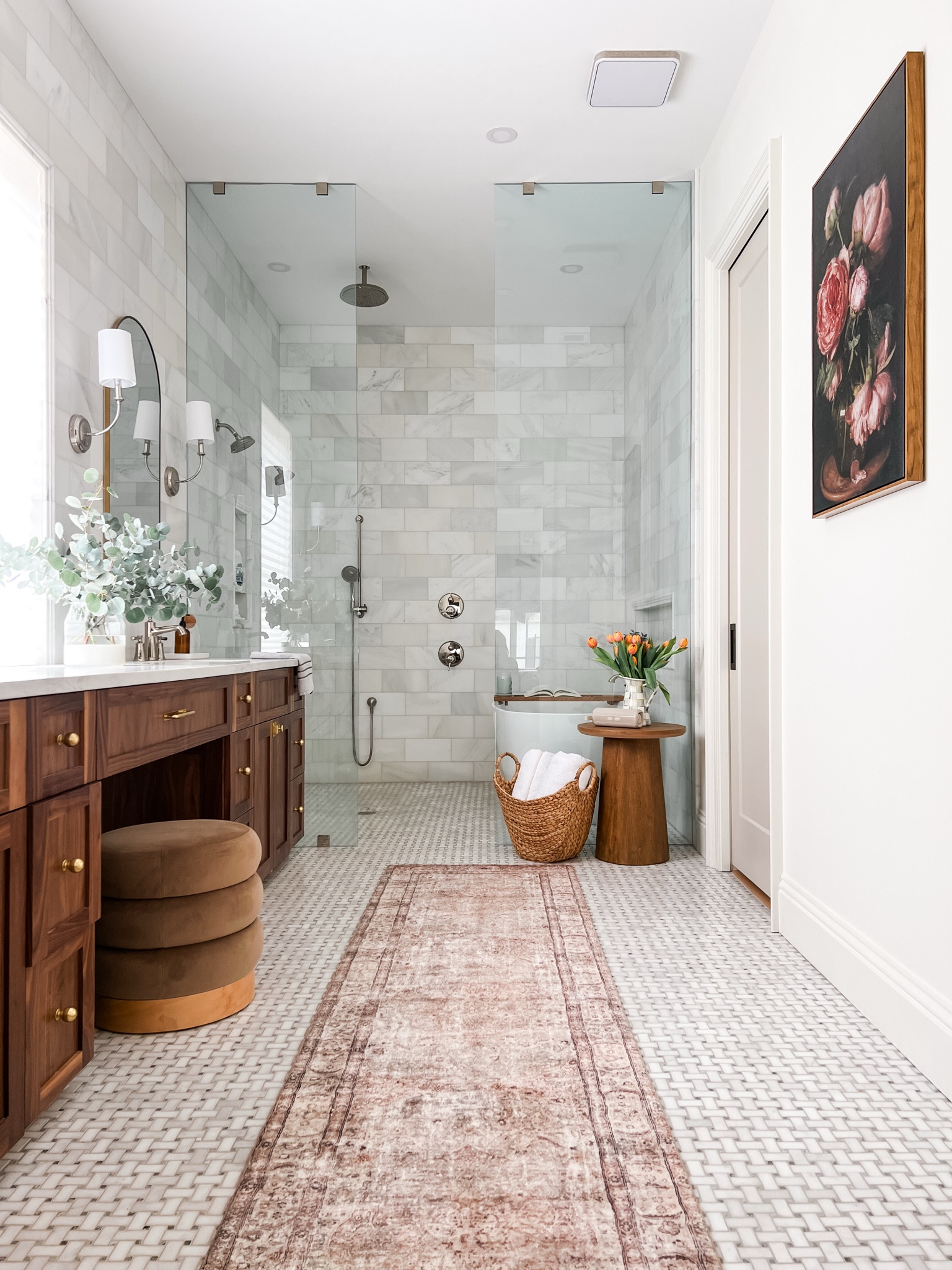 Our bathroom is one of my favorite spaces in our house. Wall Tiles are Calcatta marble from Riad tiles and floor tiles from floor and decor  The cloud pile runner adds a lot of warmth and coziness to the space. The warmer tone in the wood side table and ottoman makes the space feel cohesive. I also mixed metals here between brass and polished nickel  

#LTKFamily #LTKWatchNow #LTKHome