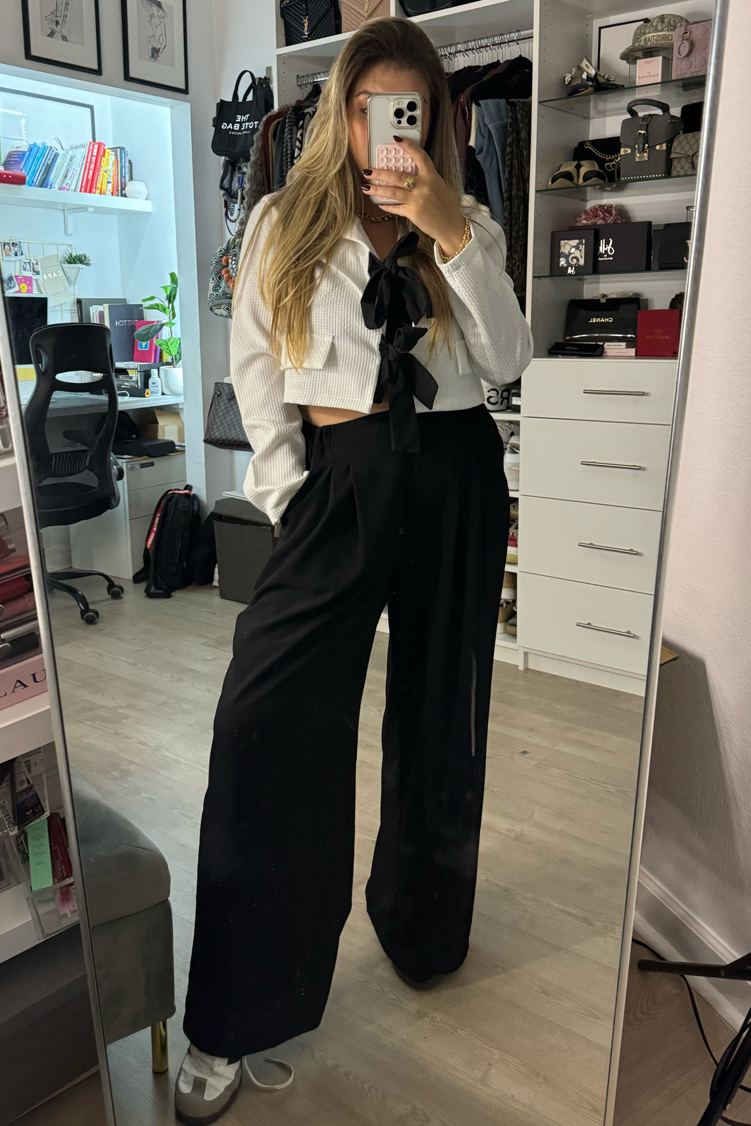 Cozy meets chic 🖤 This black bow-front sweater is a statement on its own, paired with the classic black pants every wardrobe needs. Finished the look with comfy sneakers for a laid-back vibe that works anywhere.  

#LTKMidsize #LTKFindsUnder50 #LTKWorkwear