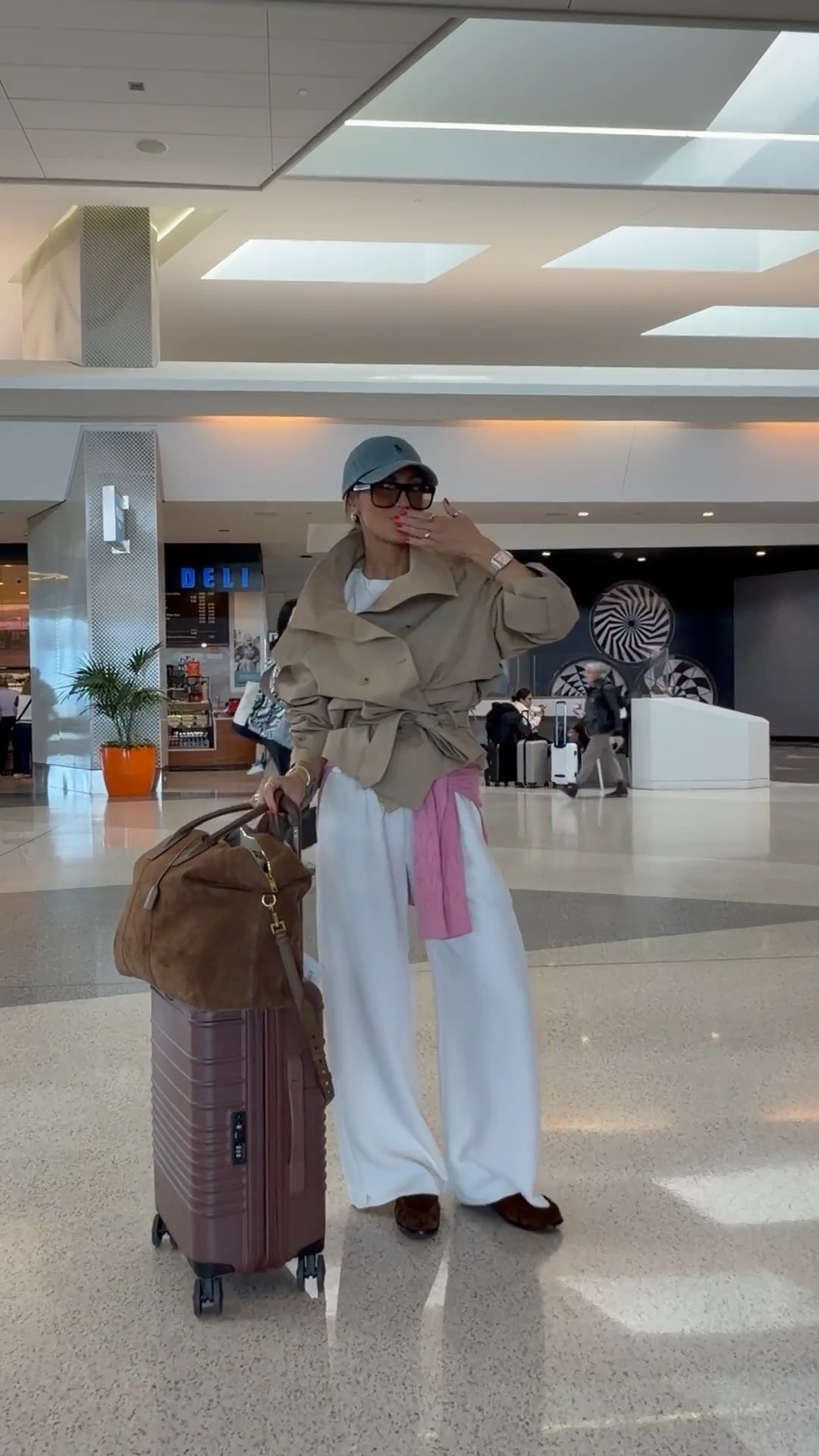 A few staples and pop of 💕 for my travel uniform✈️

Aritzia pull up pants, Zara oversized trench, TH cable knit sweater, oversized tee, Saint Laurent loafers, duffel bag, and sunnies. Ralph Lauren ball cap, chic airport outfit.

#LTKTravel #LTKSeasonal #LTKOver40