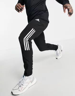 adidas Training sweatpants with three stripe in black | ASOS (Global)