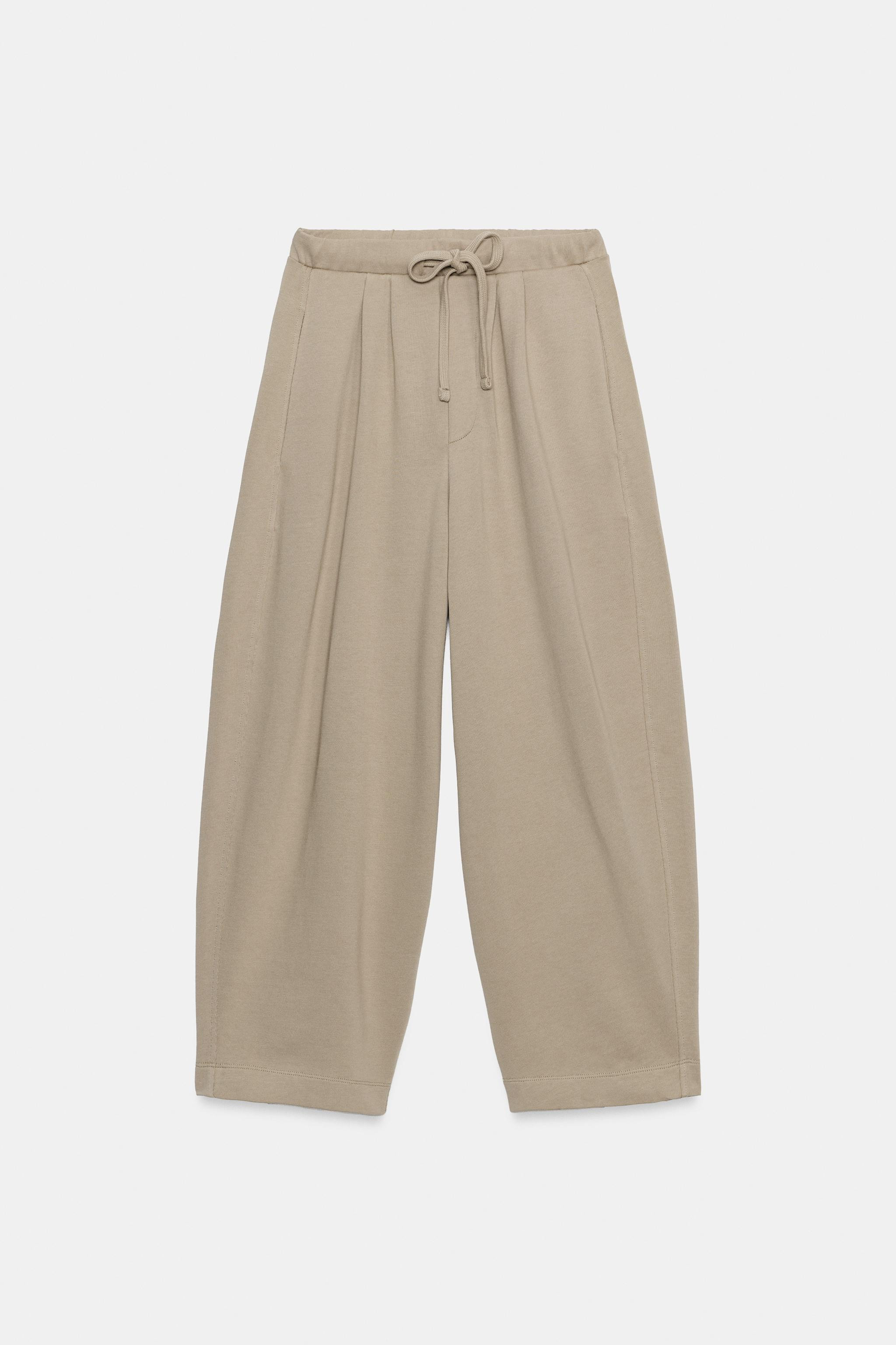 Pants with main fabric made of cotton yarn. Mid-rise with adjustable elastic drawstring waistband... | Zara US