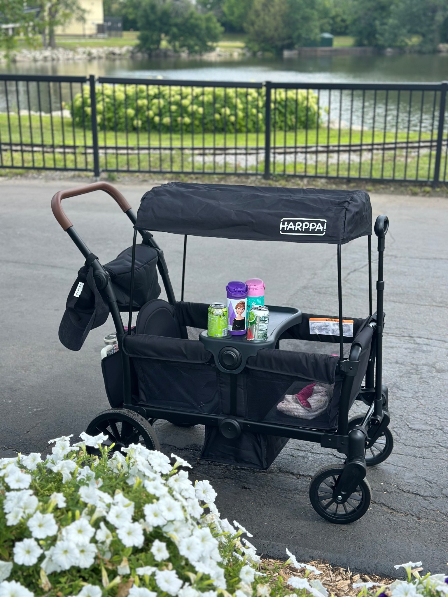 This wagon is a steal at under $200 and the quality is 🙌🏼 We took it to Adventureland and I could push and maneuver it with one hand. Both my 7 and 5 year old for it in + has a drop down for their feet to sit 🤯 

The leather handle is an added bonus + comes with these accessories:
Canopy (can be in or off) 
Zippered pouch 
Double side pouch 
Removable tray with cup holders  