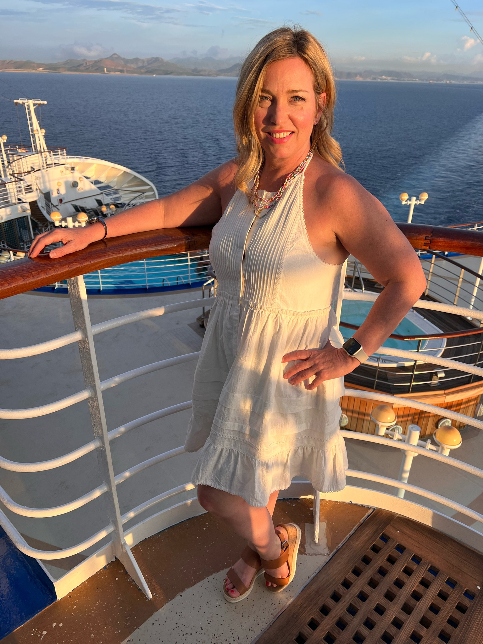 This Free People dress is so flattering! It’s the perfect travel outfit or cruise outfit and looks great with wedges. 

#LTKfindsunder50 #LTKtravel #LTKover40