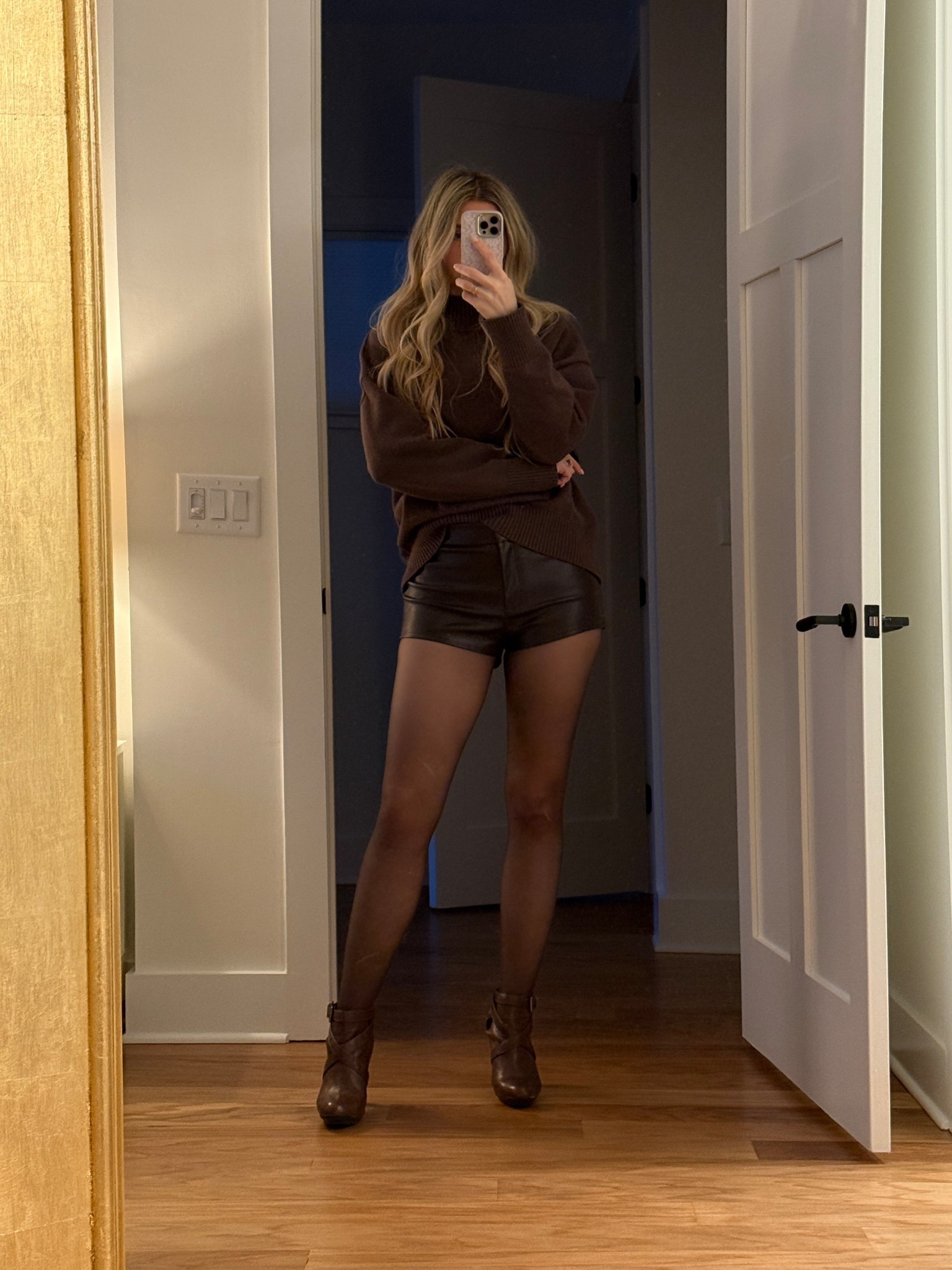 Winter date night outfit idea 

Faux leather hot pants / mini shorts @Revolve in brown (wearing a small) and I love them because I am 5’9 but they cover my bum 👏🏼 

Sweater is @Commense in small 

Tights are Noosh 

#LTKOver40 #LTKTall #LTKootd
