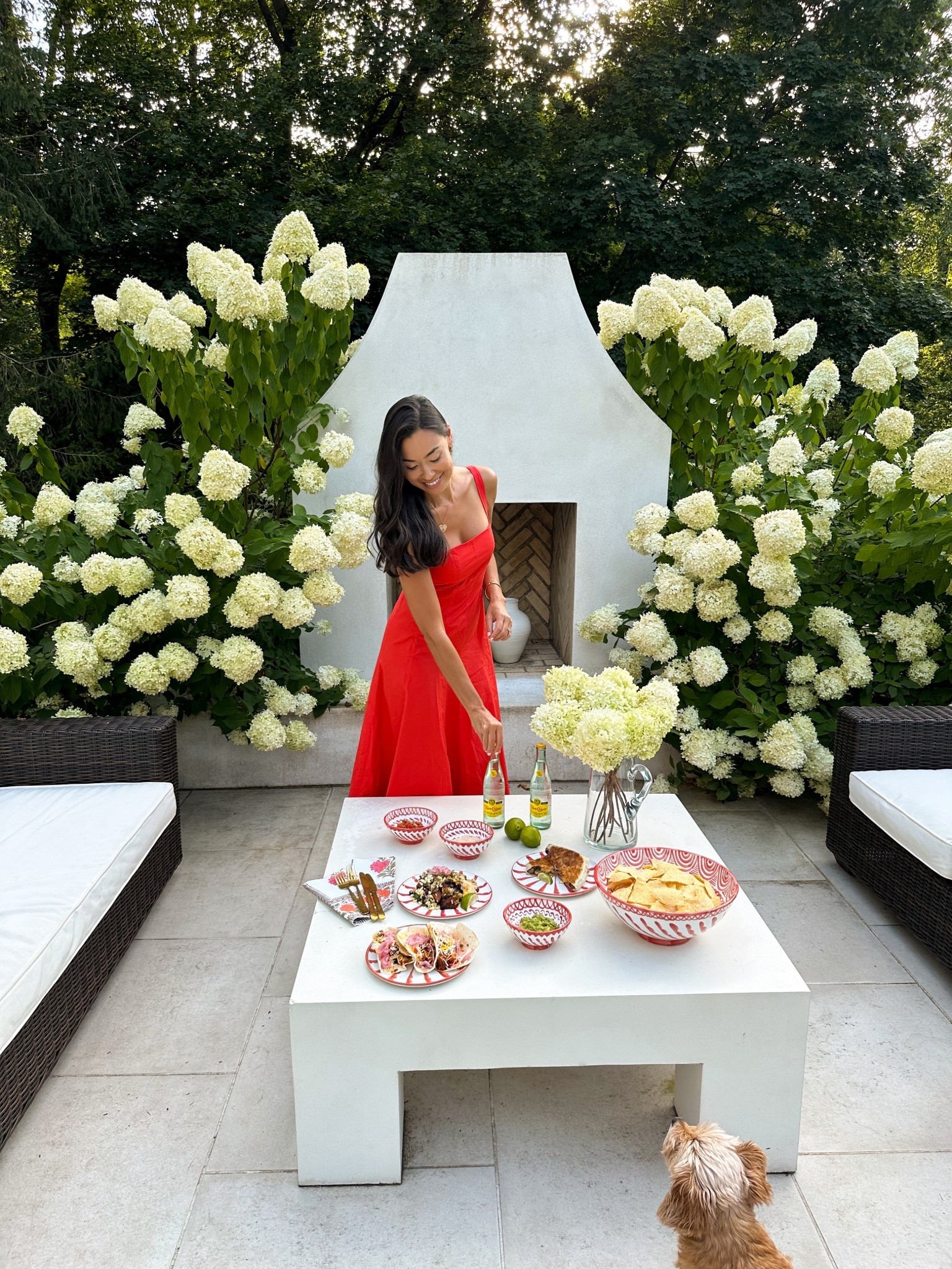 Red dress, patio, outdoor furniture, coffee table, fireplace. Pomelo Casa plates.

#LTKSeasonal #LTKHome #LTKParties