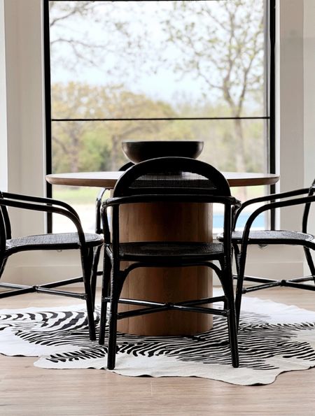 Breakfast nook spindles round dining table black gloss cane chairs zebra rug kitchen rugs dining rug 