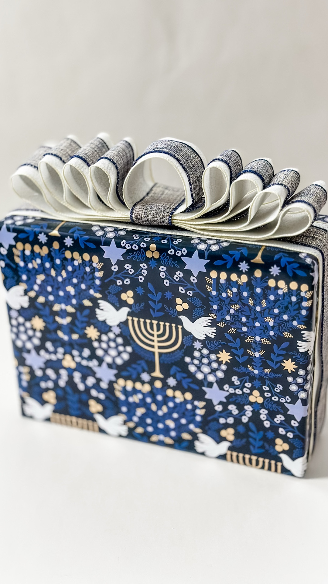 A menorah bow that’ll steal the spotlight. Because Hanukkah gifts deserve pretty bows too! 🕎✡️ Wired ribbons & paper linked here!

#LTKHoliday #LTKGiftGuide #LTKSeasonal