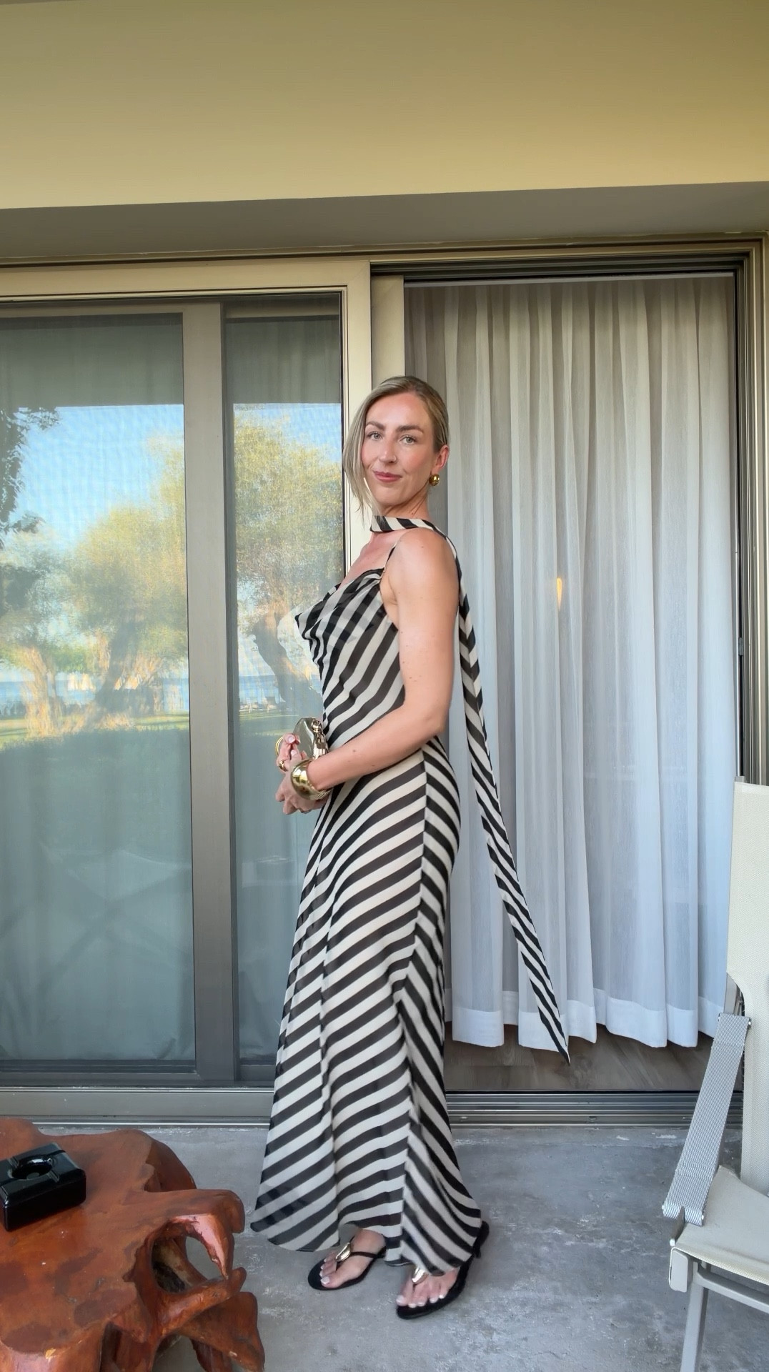 Stripe dress for dinner outfit from Mango 🖤 

Stripe dress, holiday outfits, scarf dress, gold clutch bag 

#LTKsummer #LTKdresses #LTKtravel