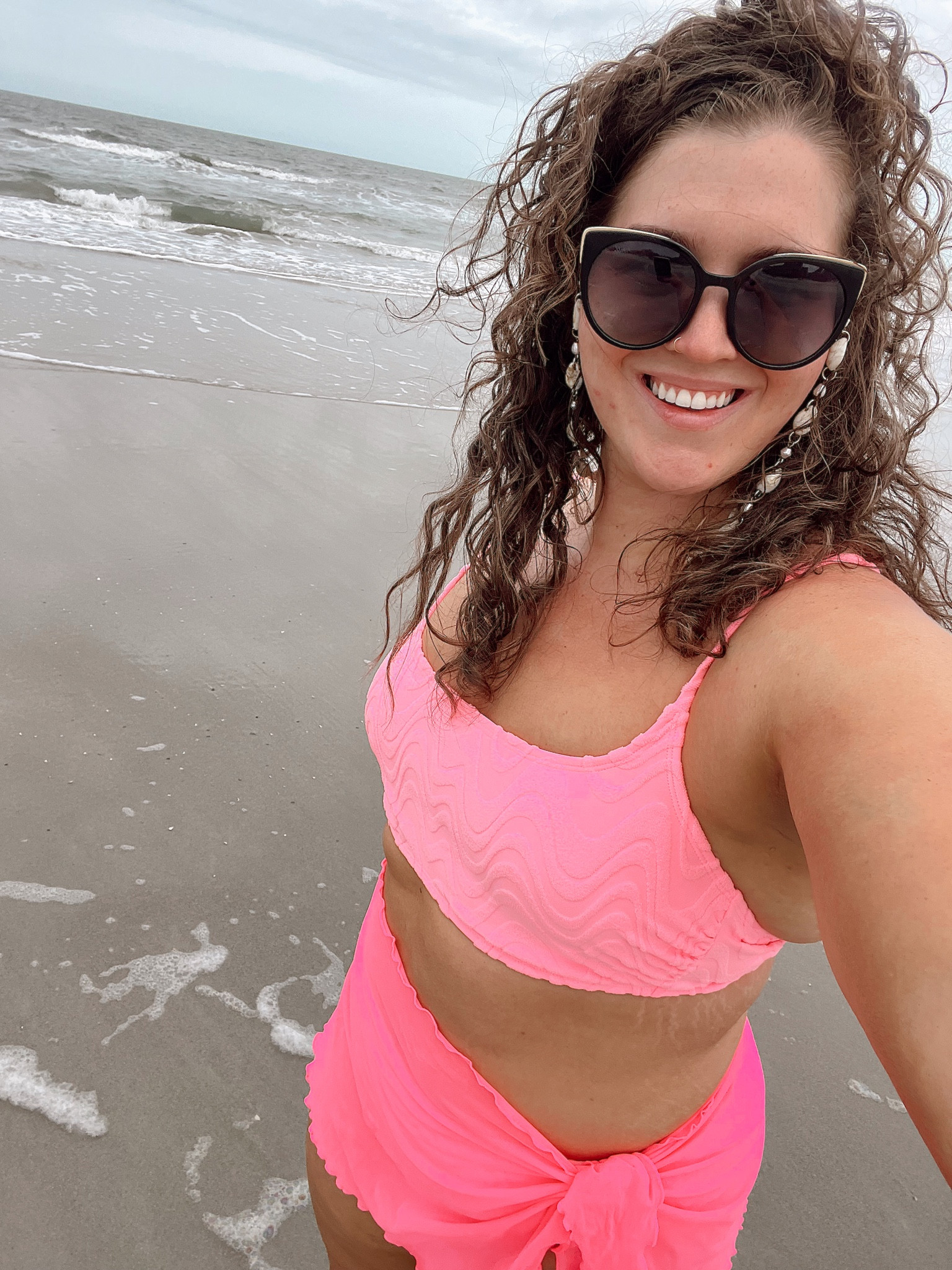Vacation day 1 🩷🌊✨
Beach outfit bikini + sarong combo 
Original sunglasses and chain sold out - linking similar! 
Top: XL 
Bottoms: X 
Sarong: L/XL 
#midsizeoutfits #beachoutfit #bikini #vacationoutfits #beachstyle #twopiece #swimsuit #sarong #sunglasses #accessories #curvystyle #affordablefashion 

#LTKstyletip #LTKtravel #LTKcurves