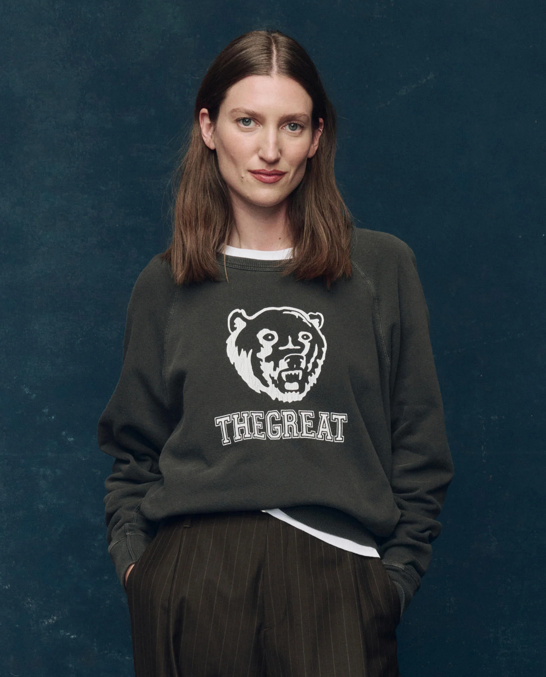 The College Sweatshirt. Graphic -- Washed Black with Bear Graphic | THE GREAT.