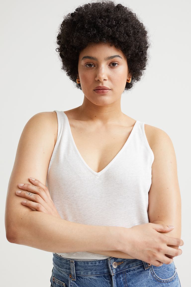 Tank top in soft jersey made from a viscose and linen blend. V-neck front and back and a straight... | H&M (US + CA)