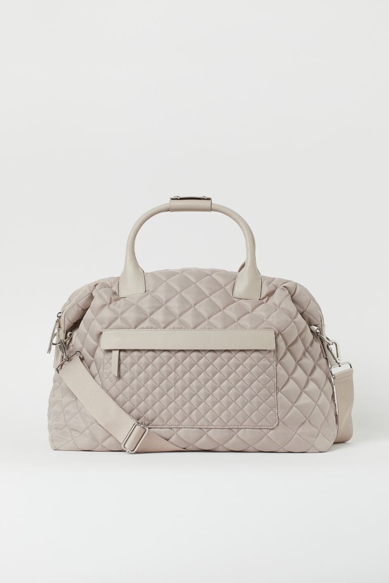 Quilted bag in woven fabric with faux leather details. Detachable, adjustable shoulder strap with... | H&M (US)