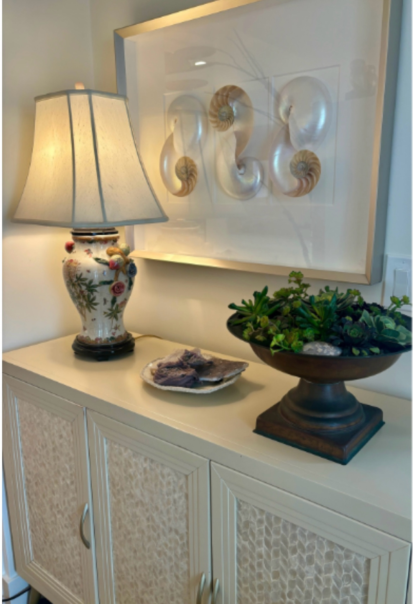 ✨ Your console table is more than just a surface, it’s an opportunity to express your personal style while welcoming your guests. Let’s create an entry that reflects your elegance and warmth. Here are a few practical design tools you can implement to elevate the look of your entry space:

1️⃣ Start with balanced decor
2️⃣ Layers of lighting to create an interesting accent
3️⃣ Personal touch
4️⃣ Make sure art is hang at the correct height
5️⃣ Mix in textures and natural elements to give an interesting dimension to the vignette

Welcome, I am Lane, Interior Designer, Founder and CEO of LEO Interior Design, a studio where we help you transform your home into a haven where you can live and thrive.
↪ Have a project that needs more design direction?
➡ Visit our website below to shop for similar items inspired by this installation
➡ Contact us, let’s connect!
➡ Send us a message
 

#LTKHome #LTKFamily