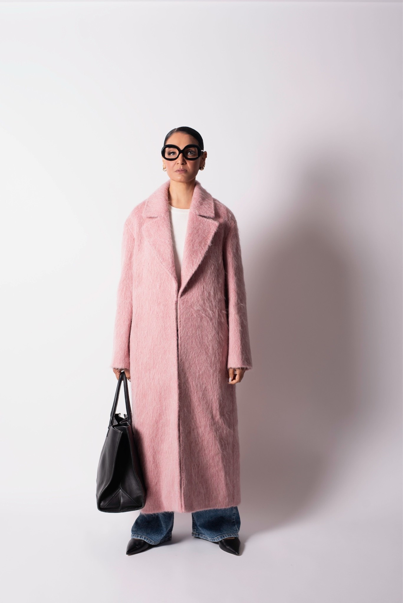 Pink, but with presence. 💗 This statement coat brings softness and drama to everyday denim, finished with sharp black accessories for the perfect contrast.

#LTKootd #LTKgrwm #LTKNYFW