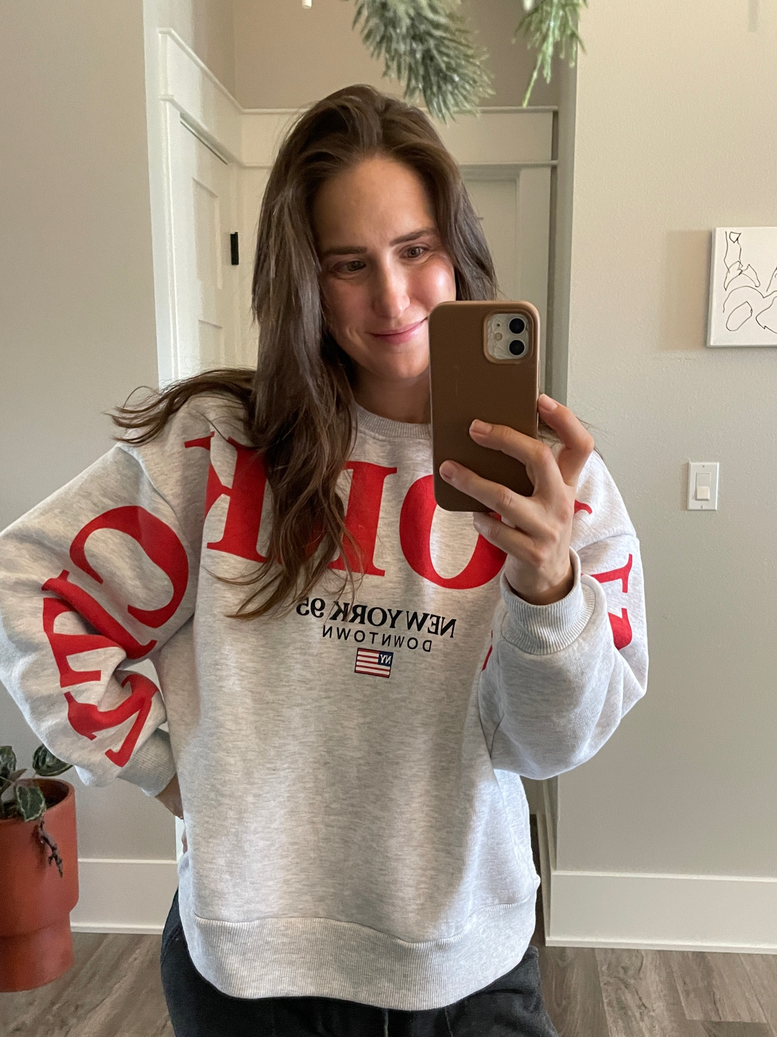 Sweats all week, but make it fun. Obsessed with the pop of red on this graphic NYC sweatshirt. From ASOS, under $50. #sweatshirt #crewneck #red #lounge 

#LTKfindsunder50