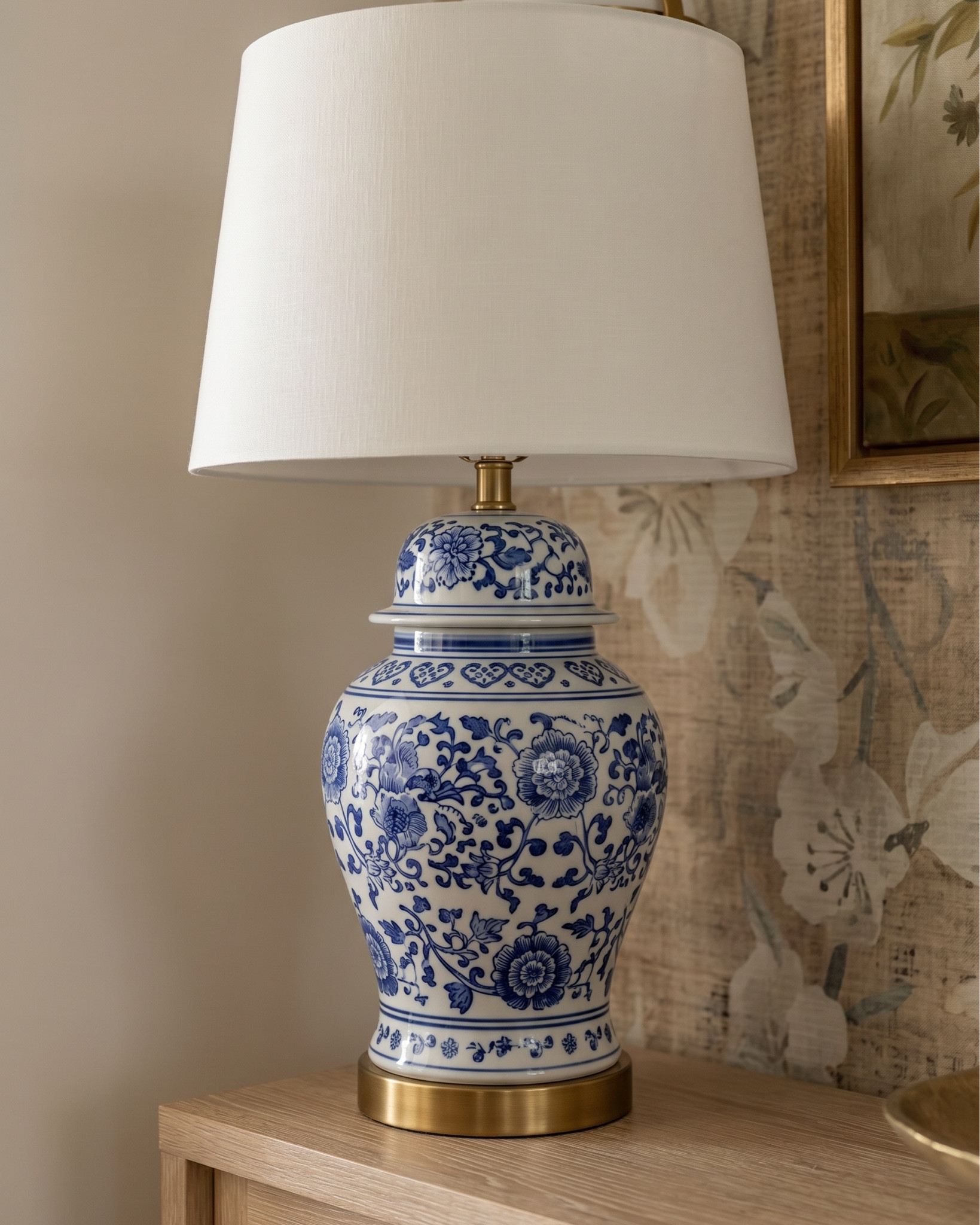 • White upholstered sofa (modern clean lines)
• Light wood frame accent chair (neutral cushion)
• Chunky knit throw blanket (cream / beige)
• Light wood rectangular coffee table (minimal / modern)
• Neutral checkered area rug (brown / cream pattern)
• Marble fireplace surround (white with gray veining)
• Large abstract landscape wall art (neutral tones, gold frame)
• Built-in shelving (painted soft gray)
• Decorative books (neutral stacked styling)
• Small ceramic decor objects (matte black / stone finish)
• Brass candle holders (modern minimal)
• Glass decorative vases (clear / smoked)
• Wood ceiling beams (light natural finish)
• Round flush mount ceiling light (white globe)
• Ceramic vase (rounded neutral tone) • Fresh floral arrangement (yellow + white flowers) • Decorative tray (light wood or stone) • Stacked coffee table books (neutral covers) • Small brass sphere decor object
• Light wood side table (open shelf design) • Blue and white ceramic ginger jar • White table lamp (fabric shade, brass detail)
• Light wood sideboard cabinet (cane / woven door fronts) • Cane panel credenza (natural oak finish) • Blue and white ceramic ginger jars (traditional style) • White ceramic bowl (centerpiece decor) • Brass decorative tray (organic shape) • Floral still life wall art (gold frame) • Neutral floral wallpaper (textured / vintage style) • Brass wall sconces with white glass shades • White table lamp with brass hardware • Large ceramic table lamp base (blue/white pattern)


#LTKSaleAlert #LTKHome