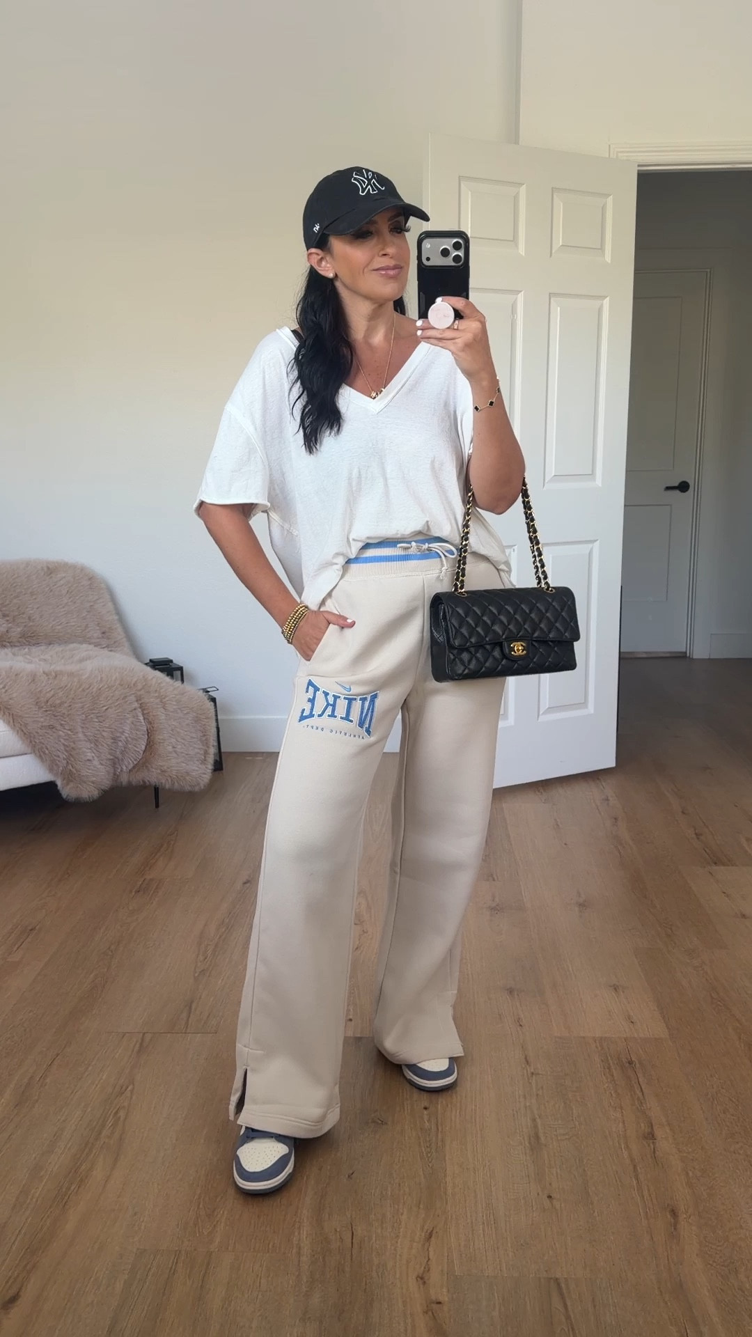 Nike sportswear phoenix fleece women’s high waisted wide leg pants wearing size small 

Free people white oversized tee wearing size xs