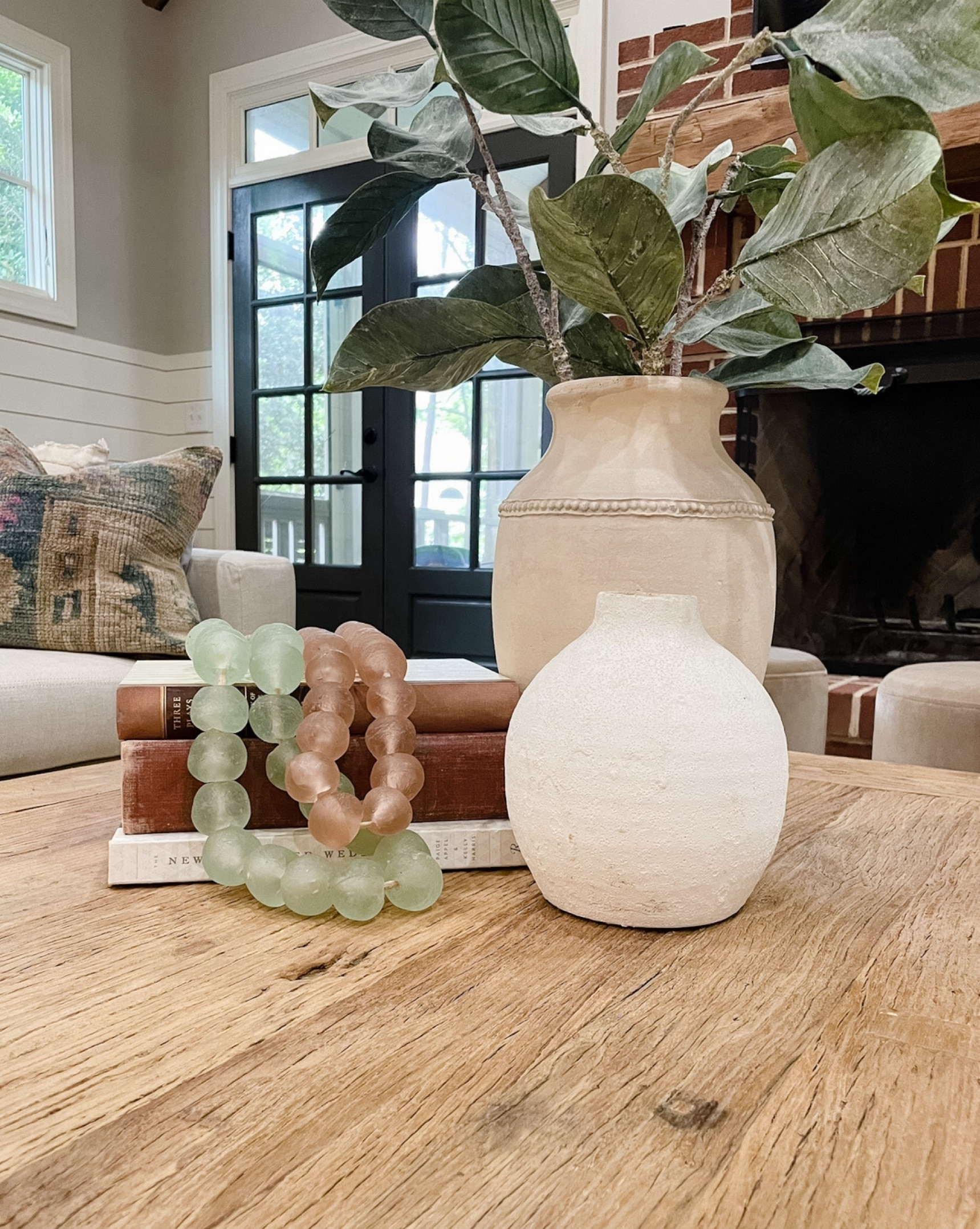 Elevate your coffee table by stacking vintage books and layering peonyandolive.com recycled glass beads on top.  Pair with vases of varying heights and shapes and greenery ✨

#LTKstyletip #LTKhome