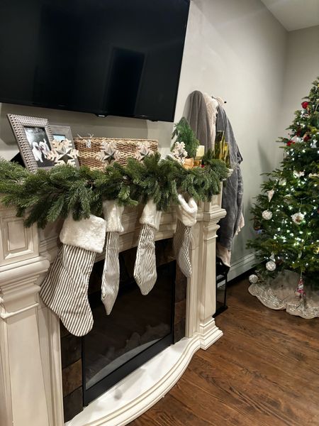 Christmas mantle 
Candles 
Garland 
Fireplace 

#LTKHoliday #LTKhome #LTKfindsunder100