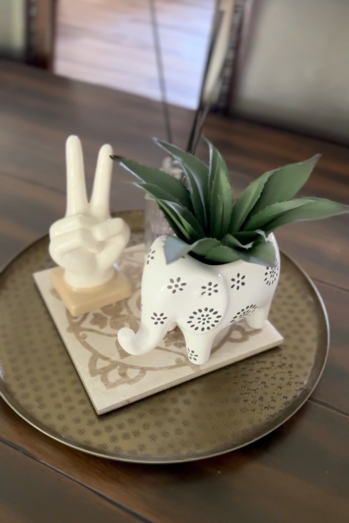 It’s all in the details. Check out these budget friendly finds for your next table decor! . I’m currently staging my house!  FOLLOW ME to watch tips and tricks to home decor!  This particular arrangement is for our dining room table. Check out all the different heights and widths of each product. I love decorating in threes… the objects compliment each other and they are all on different levels creating an esthetically pleasing piece. I added in an extra layer by using a left over decorative tile for the base. Make sure to follow to watch more decor tips and tricks!  

#LTKStyleTip #LTKHome