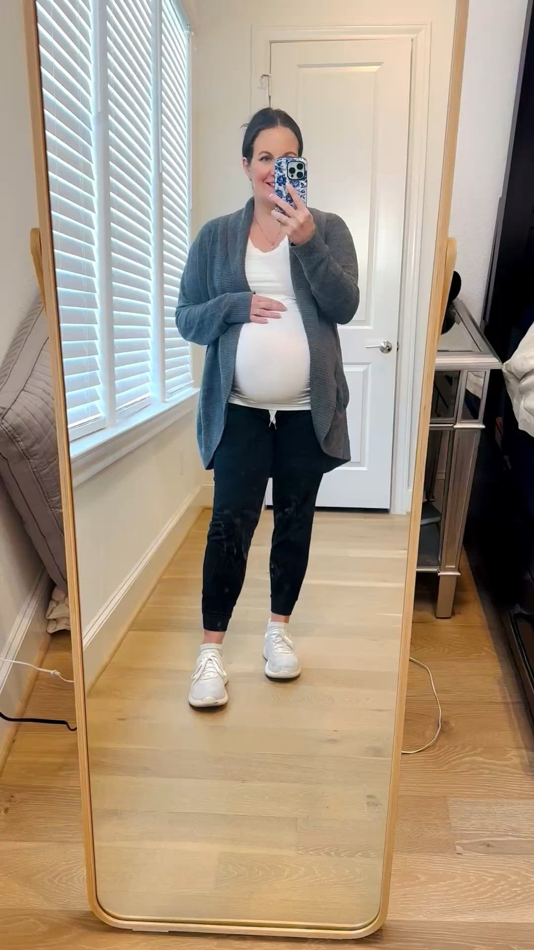 Lived in this comfy outfit during pregnancy —especially on cold days when I want to feel put together but cozy. This maternity outfit is the perfect loungewear look, featuring a soft gray cardigan sweater layered over a white maternity tee and paired with comfortable black joggers pants. The jogger pants are part of the LTK spring sale!

I finished the look with white slip on sneakers for an easy, casual vibe that still works for errands or coffee runs. If you’re looking for comfy and cozy outfits for cold days, this is such a great pregnancy-friendly option that you’ll reach for on repeat all season long.

Everything is linked below so you can recreate this cozy maternity look 


#LTKPetite #LTKBump #LTKootd