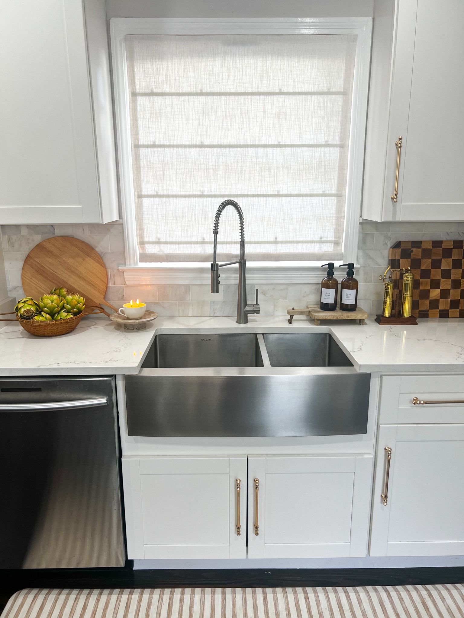 Kitchen sink accessories and decor including cutting board, Roman shades, soap dispensers, brass pepper mills 

#LTKfindsunder100 #LTKhome #LTKsalealert