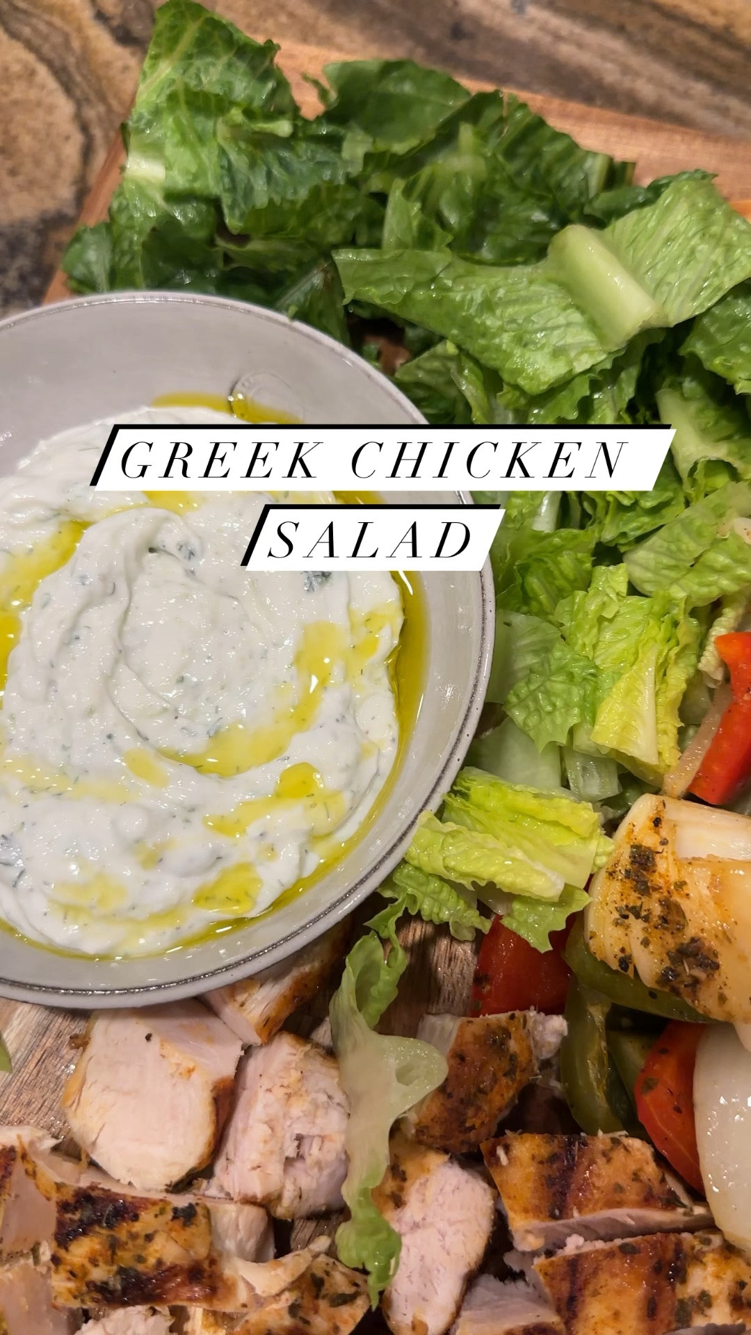 Greek Chicken Salad

Tzatziki
1 cup plain Greek yogurt
1 persian cucumber, grated and drained
2 tablespoons fresh dill, chopped
1/2 lemon, juiced
1 tsp garlic powder
1 tsp salt
1 tsp pepper
1 tsp red wine vinegar
drizzle of olive oil

Grate and drain the cucumber, discard any liquid. Add cucumber, dill, lemon juice and seasonings to the yogurt. Stir. Add seasonings. Let sit for at least 30 minutes. Before serving, drizzle olive oil over the top. 

1 red bell pepper, cut into 1 inch pieces
1 green bell pepper, cut into 1 inch pieces
1 yellow onion, cut into 1 inch pieces
2 chicken breasts

Greek Marinade for chicken and veggies:
1/4 cup olive oil
1/2 lemon, juiced
2 garlic cloves, grated
1 tsp red wine vinegar
1 tsp onion powder
2 tsp dried basil
2 tsp oregano
2 tsp paprika
1 tsp pepper
1/2 tsp thyme
1 tsp salt
1 tablespoon dried oregano
1 tsp salt

Dice veggies, then sprinkle half of the marinade over them, mix to combine.
Coat chicken with the other half. 
When ready to cook, preheat grill pan in the oven to 400. 
Cook chicken on a cast iron grill pan, 7 minutes a side or until done.
Roast veggies on a sheet pan for 7 minutes, flip and cook until just starting to char. 

Remove from the oven, let come to room temperature.
Slice the chicken. 
Build your salad bowl with lettuce, veggies, chicken, tzatziki. Serve with hummus, pita bread and extra lemon!

#LTKHome #LTKVideo