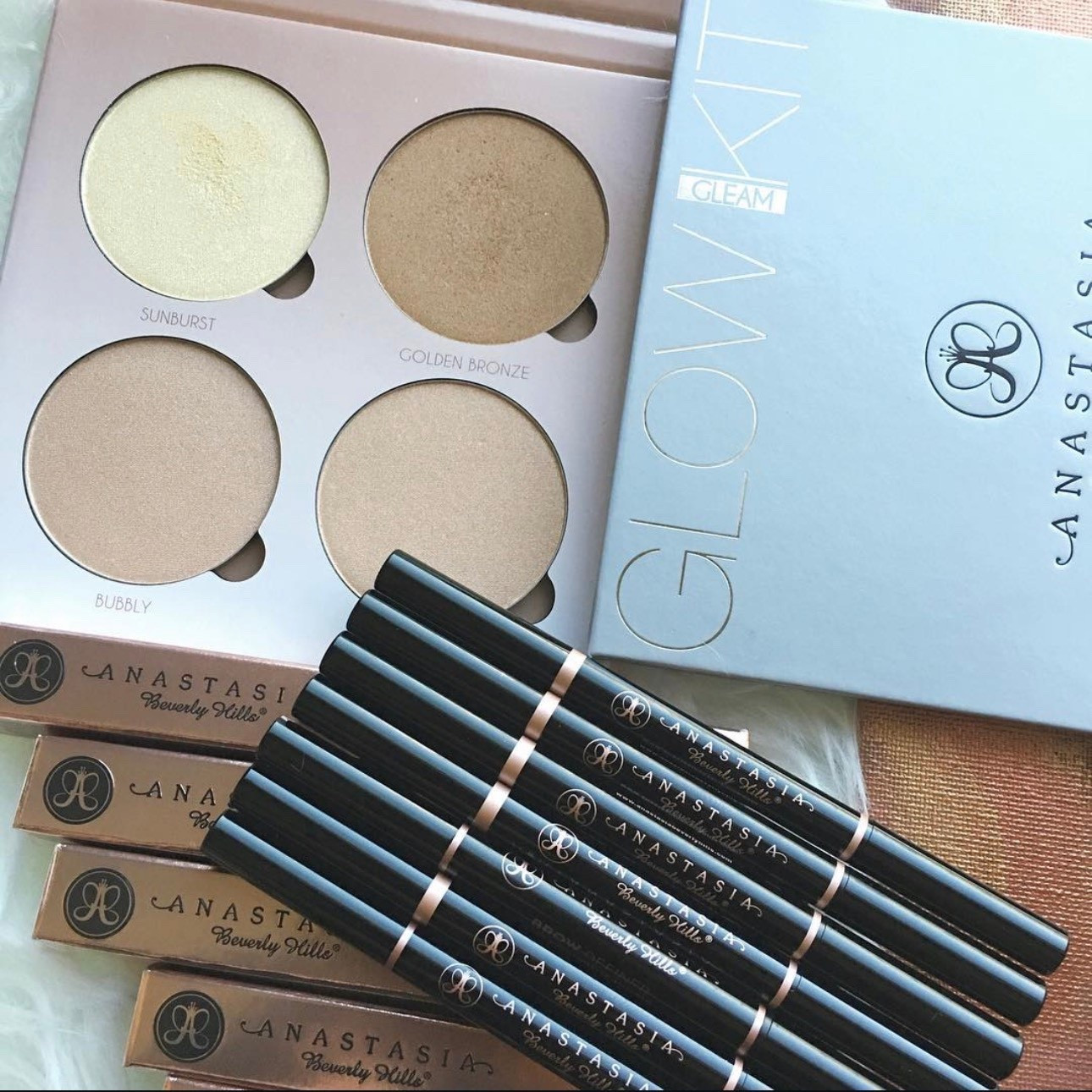 Anastasia Beverly Hills favorites! The Brow Definers are perfect for a quick, structured brow. The slanted tip can make either hair like strokes or bold fills. The Glow Kits are beautiful for a glowing completion. I even use these on the eyes for an extra twinkle over the center of the eye. The Gleam kit pictured has been discontinued, but the ones I use a lot are Sugar and Sundipped.  I would consider Sugar to be great for light to medium skin tones, and Sundipped for medium to deep!  All the skin tones can wear these. Love it.😍 

#LTKFindsUnder50 #LTKselfcare #LTKBeauty